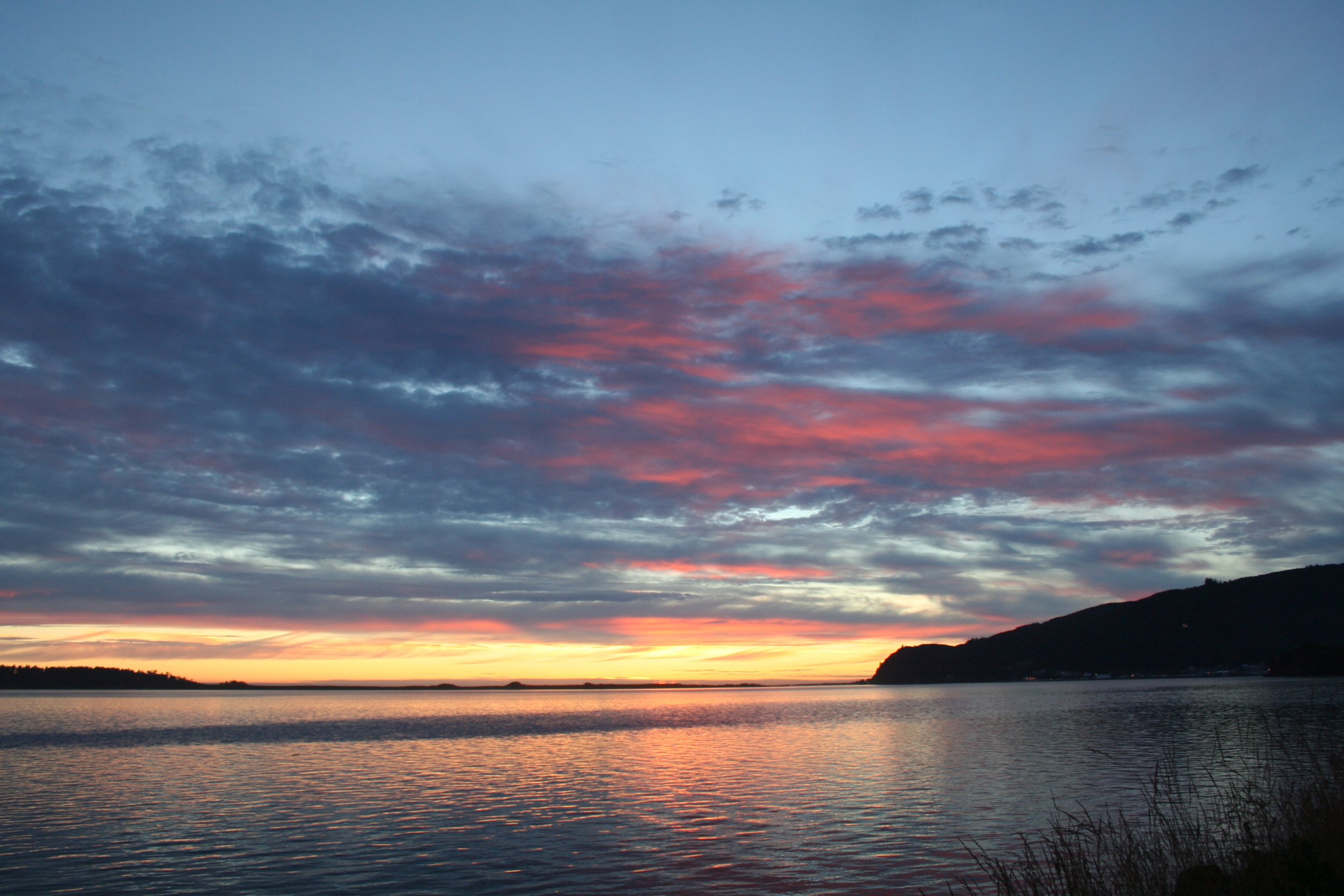 Tillamook Bay just after sunset 9:17pm PDT, from US-101 south of Bay City, Oregon (45.535934,-123.899174)