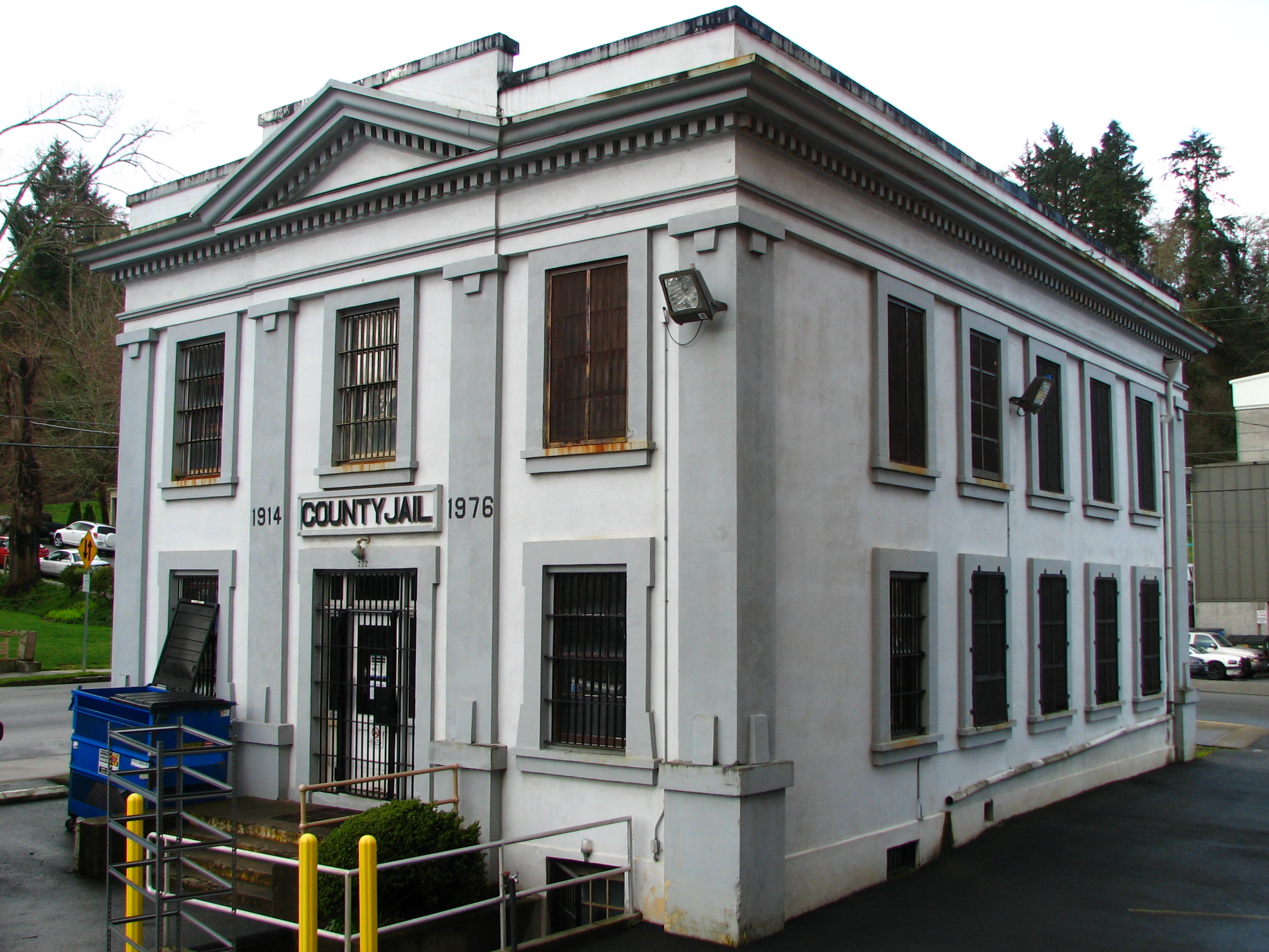 The historic Old Clatsop County Jail (built 1913), located at 732 Duane Street in Astoria, Oregon, United States, is listed on the US National Register of Historic Places (NRHP). Since 1976, it is no longer in use as a jail, and in 2010 it was reopened as the Oregon Film Museum. A corner of the current sheriff's office and jail is narrowly visible in the right background of this photo. Photo was taken from the rear steps of the county courthouse.