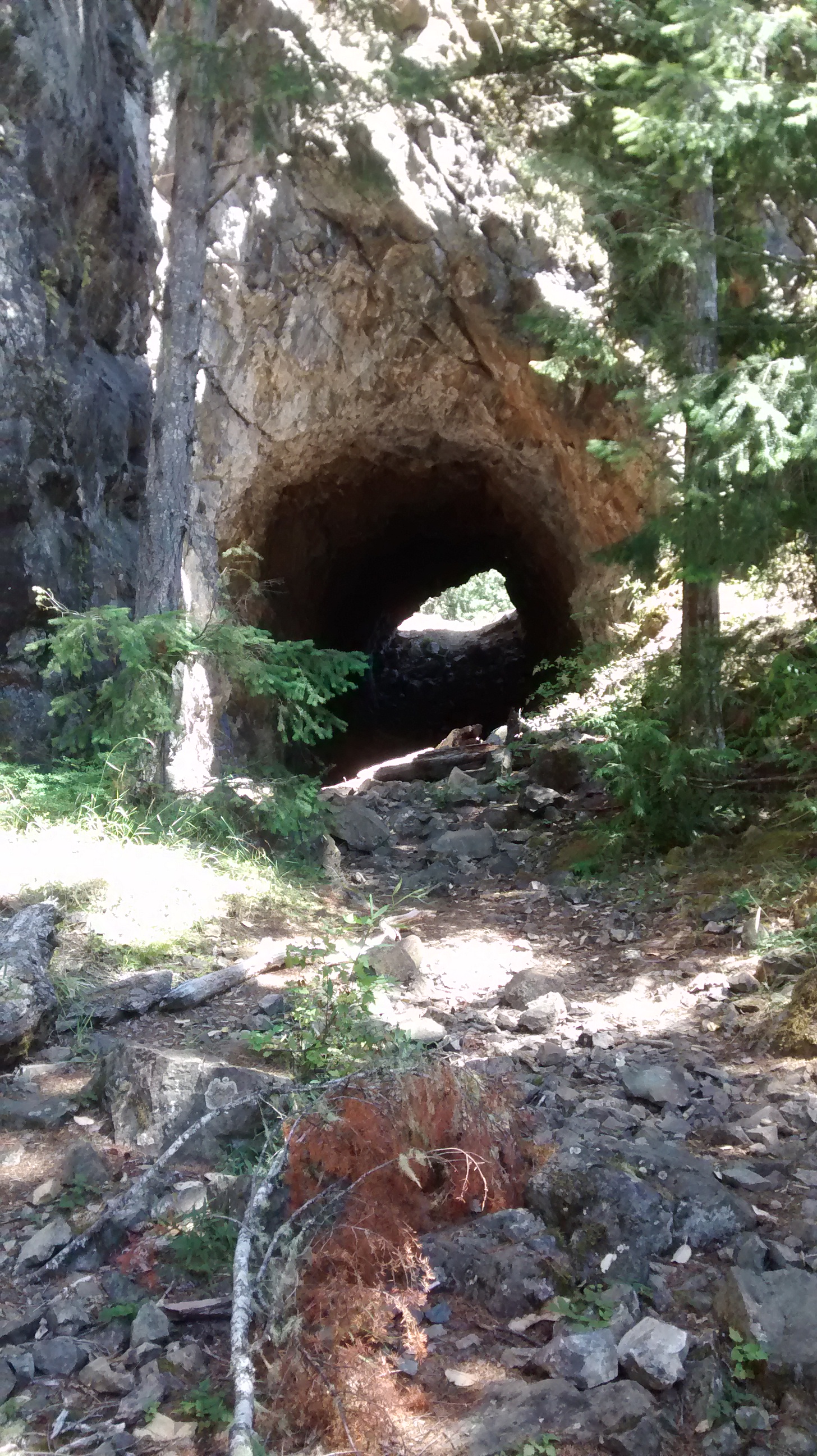 Photo through the Daley-Rankin Tunnel, part of the Spruce Railroad Trail