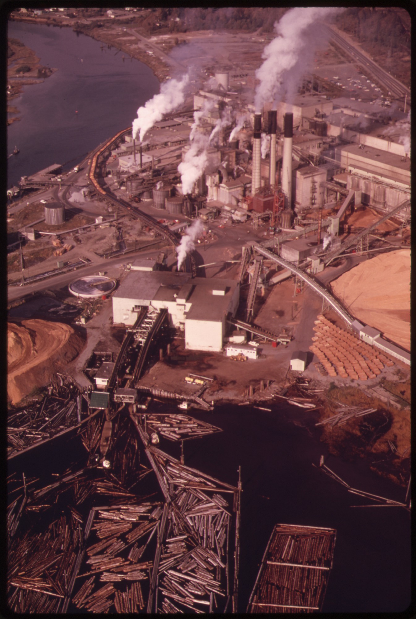 MACMILLAN-BLOEDEL, LTD., A LOG PROCESSING PLANT IN PORT ALBERNY, VANCOUVER ISLAND, CANADA. NEAR SAN JUAN ISLAND... - NARA - 555165.jpg
