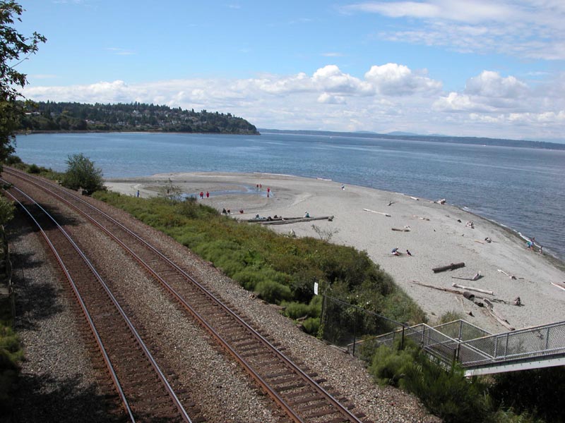 The Puget Sound beach at Carkeek Park, Seattle, Washington, USA. Photo taken from the pedestrian overpass over the BNSF railroad tracks.