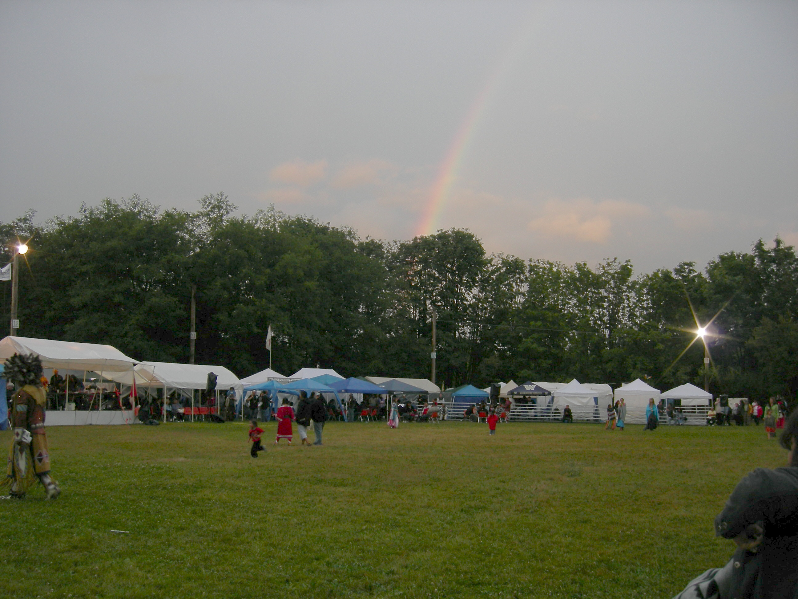 Rainbow over Seafair Indian Days Pow Wow, Daybreak Star Cultural Center, Seattle, Washington. The event is part of Seafair (a series of annual summer events in Seattle) and under the aegis of the United Indians of All Tribes Foundation.