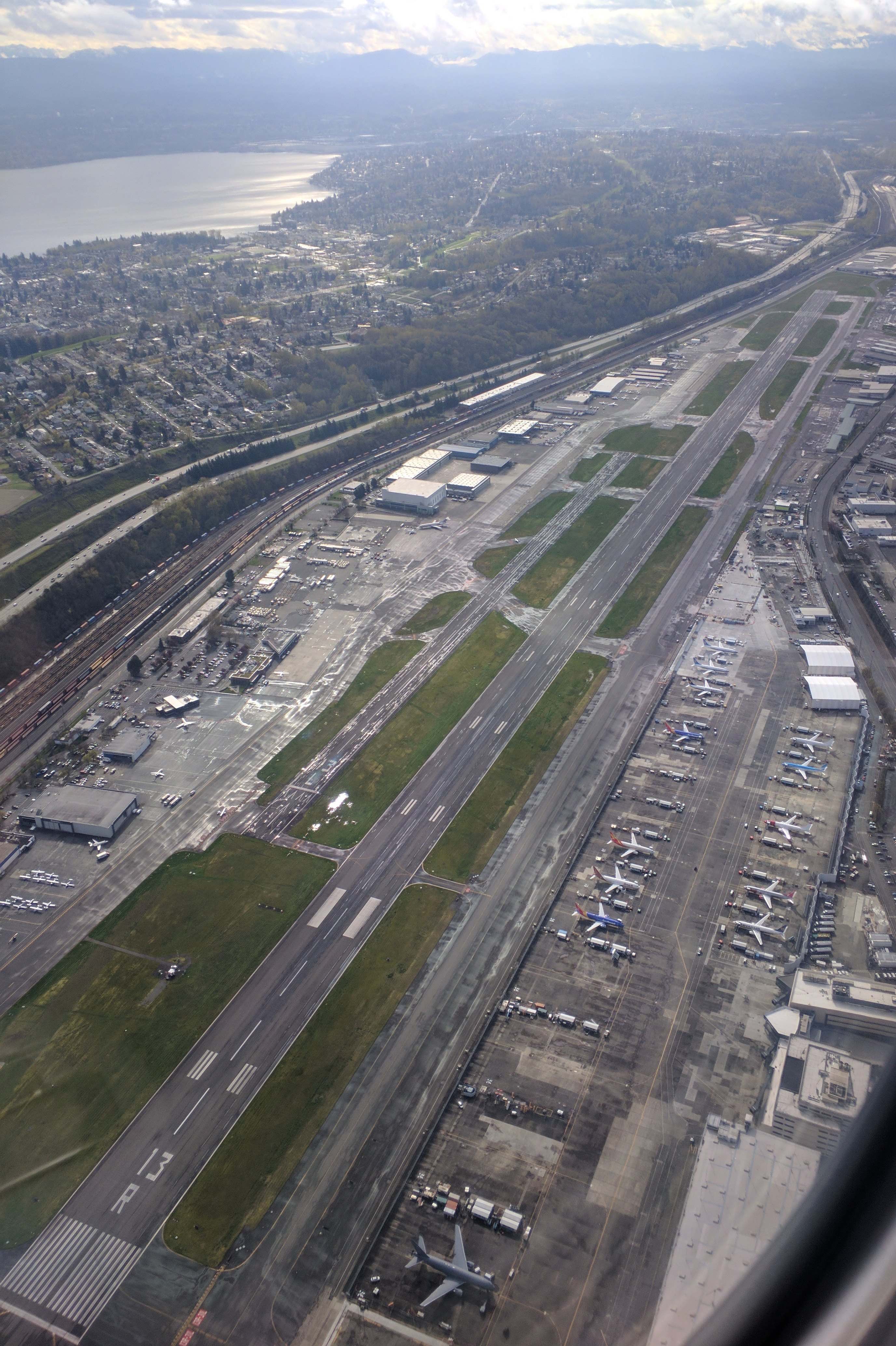 King County International Airport-Boeing Field, Seattle, Washington, aerial from the northwest. This shows the two runways labeled as 13L/31R and 13R/31L. The runways were updated in August 2017 and are now labeled 14L/32R and 14R/32L.