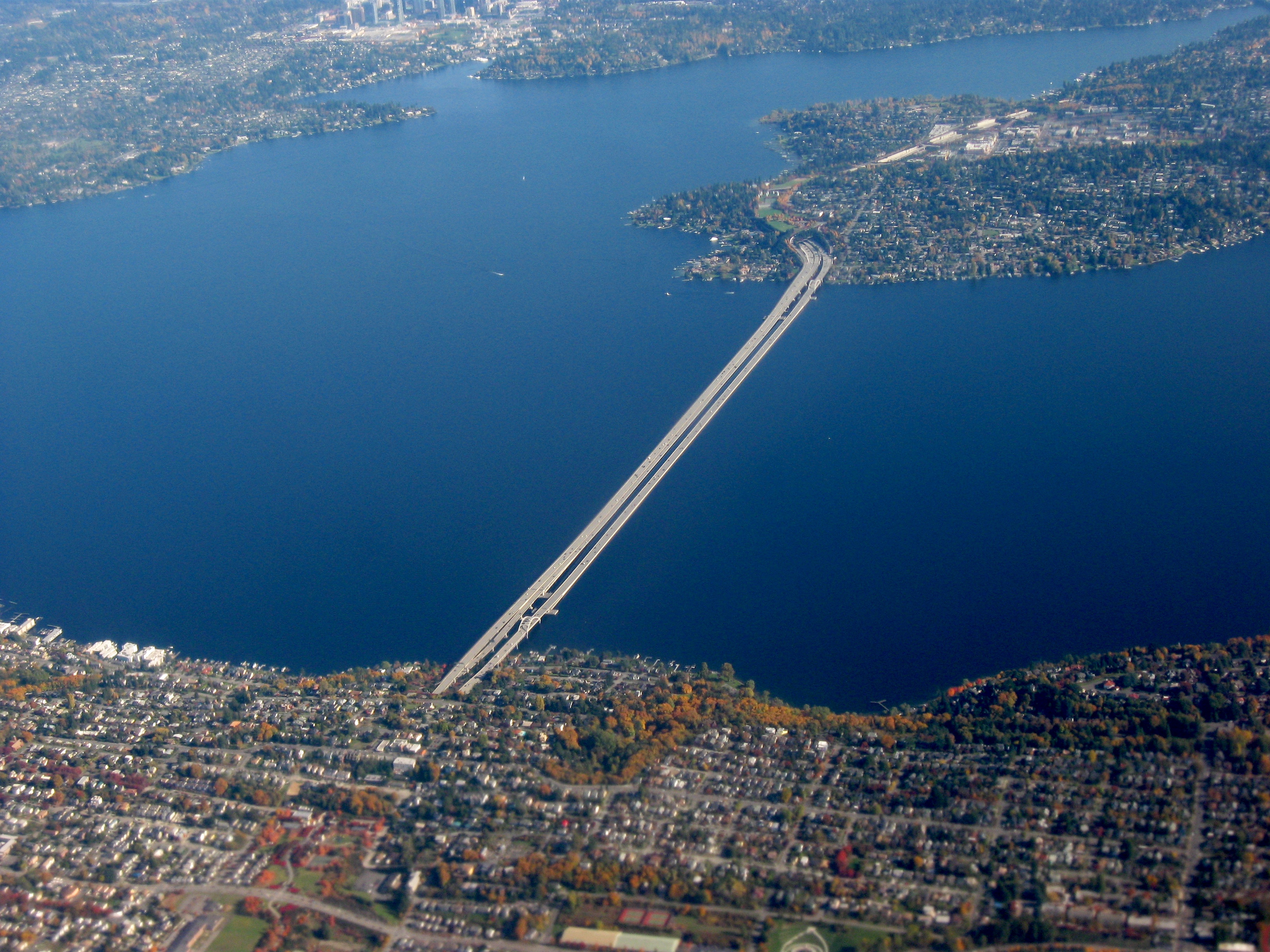Interstate Highway 90 bridge from Mercer Island (top right) to Brighton area of Seattle (bottom left) across Lake Washington. Facing northeast from Seattle. A bit of downtown Bellevue is visible in the upper-left. Taken by myself from a commercial airliner window.