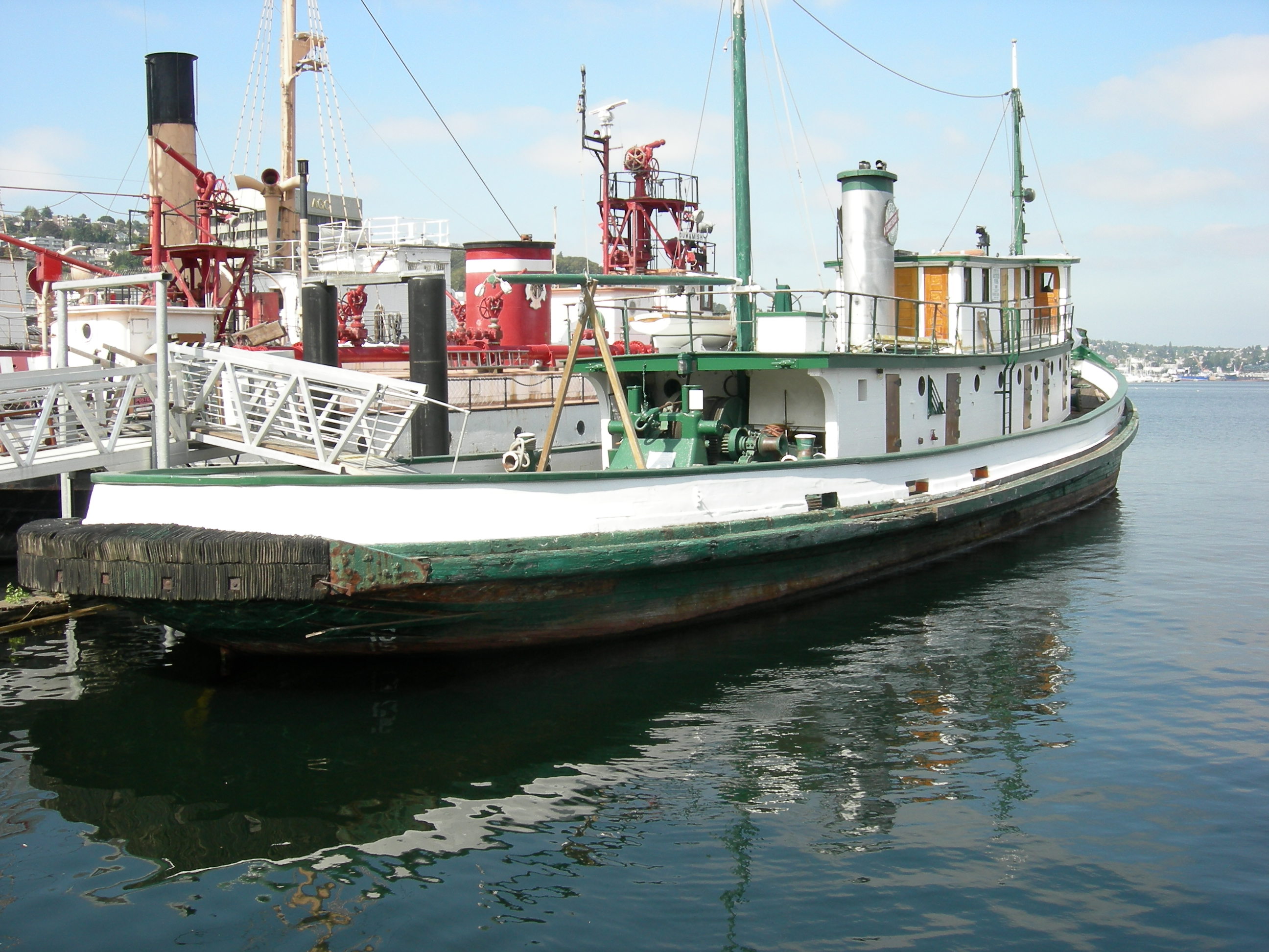 The tugboat Arthur Foss, built 1889, one of the historic fleet of Northwest Seaport, South Lake Union Park, Seattle, Washington, USA. The tug is a Seattle city landmark and is listed  on the National Register of Historic Places (NRHP), ID #89001078. Other ships behind it include the Swiftsure, also a city landmark and on the NRHP.