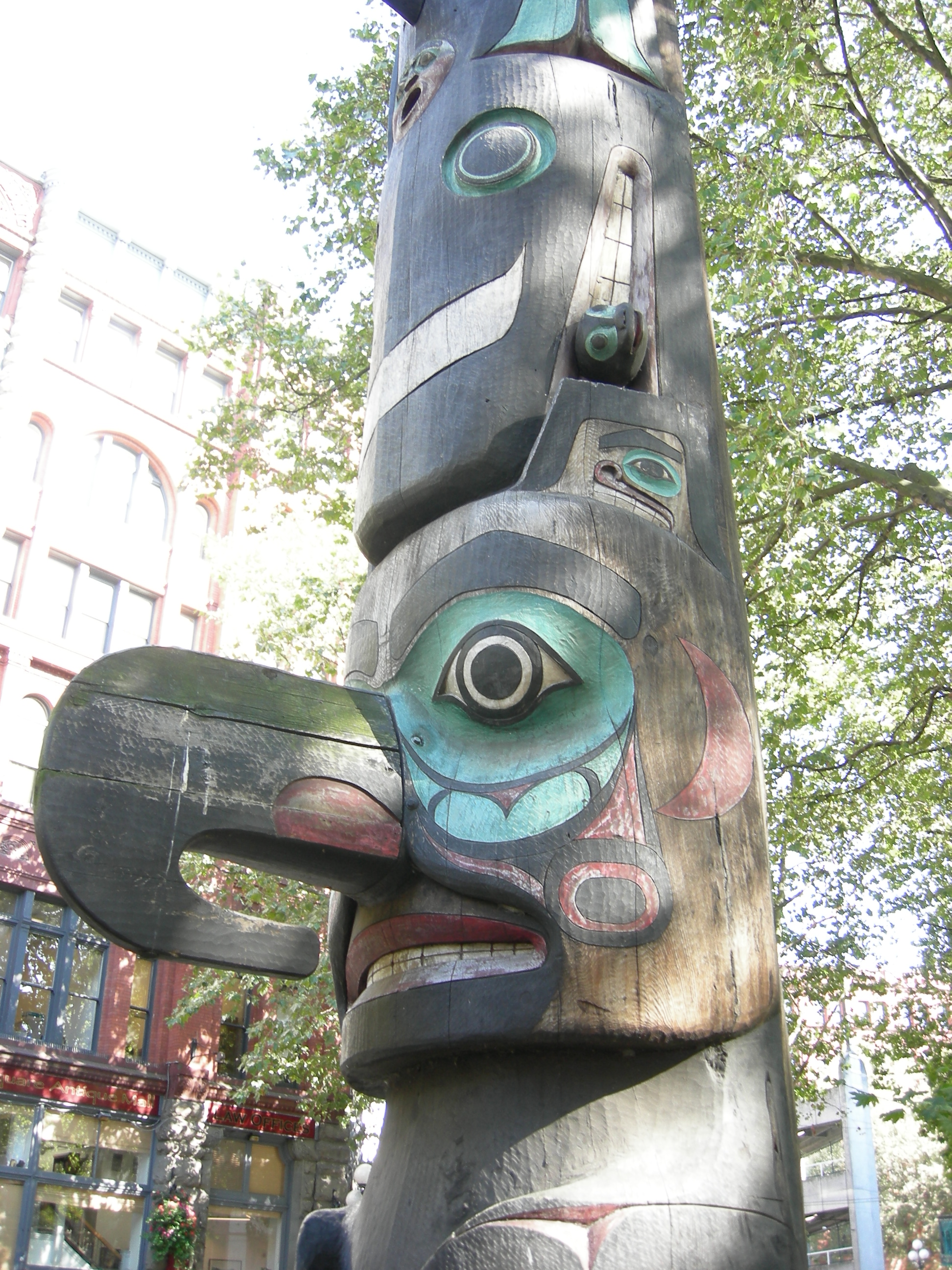 Detail of totem pole, Pioneer Square, Seattle, Washington, USA. Listed, along with the Pioneer Building and Iron Pergola, on the National Register of Historic Places, ID #77001340. There is also a broader inclusion for the Pioneer Square - Skid Row Historical District.

This is a 1930s replica of the original Pioneer Square totem pole, which was damaged by arson. It is carved by descendants of the original carvers. [1]