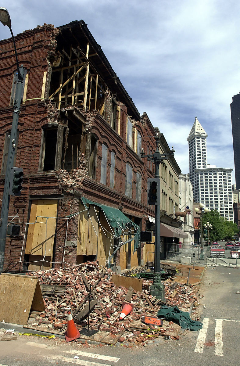 Earthquake damage to Cadillac Hotel 319 Second Avenue South, Pioneer Square neighborhood, Seattle, Washington, 2001. Built 1890. The building was subsequently repaired by the Historic Seattle PDA to house the Klondike Gold Rush National Historic Park Museum and National Park Service Regional Headquarters. (Smith Tower in background.)For more information see Summary for 319 2nd AVE / Parcel ID 5247800715, Seattle Department of Neighborhoods. (Same building, even though they accidentally omitted "South" from the address.) Also page about the Cadillac Hotel rehabilitation after the 2001 earthquake, on the site of Historic Seattle.