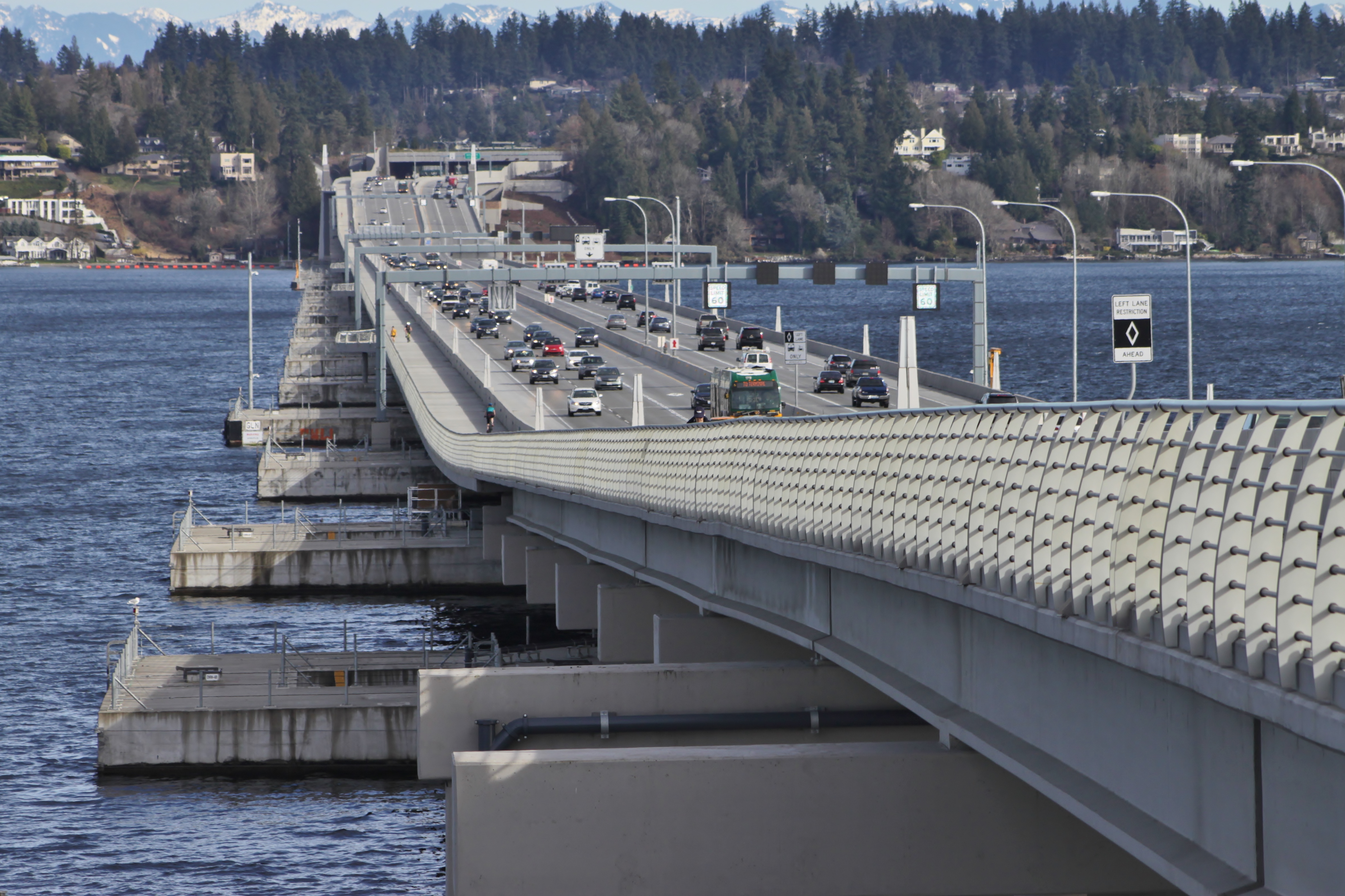 The Evergreen Point Floating Bridge, carrying State Route 520 over Lake Washington, seen from the north side bicycle and pedestrian trail from the west high-rise.