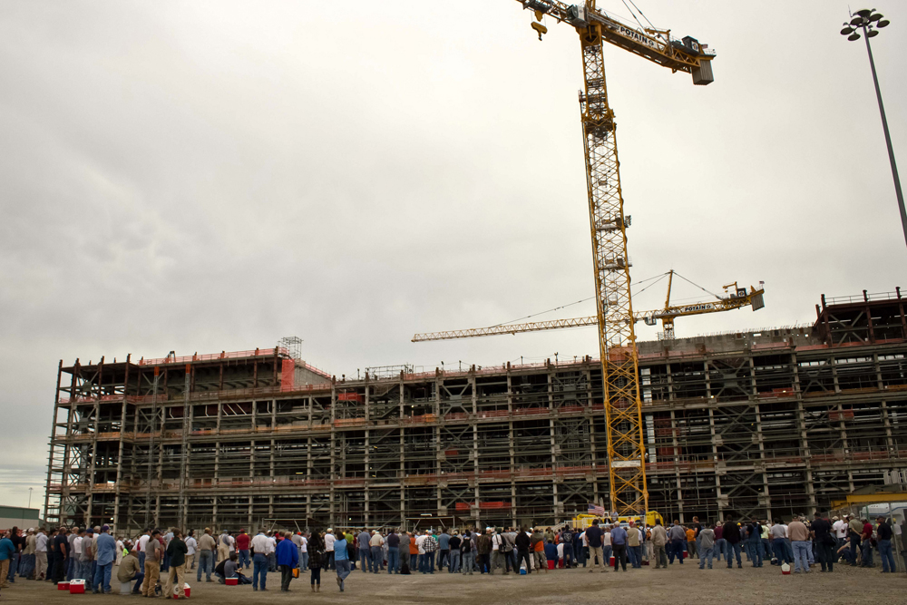 Employees at Hanford's massive Waste Treatment Plant construction project gather around during an all-employee meeting with the Department of Energy's Secretary Chu in June.