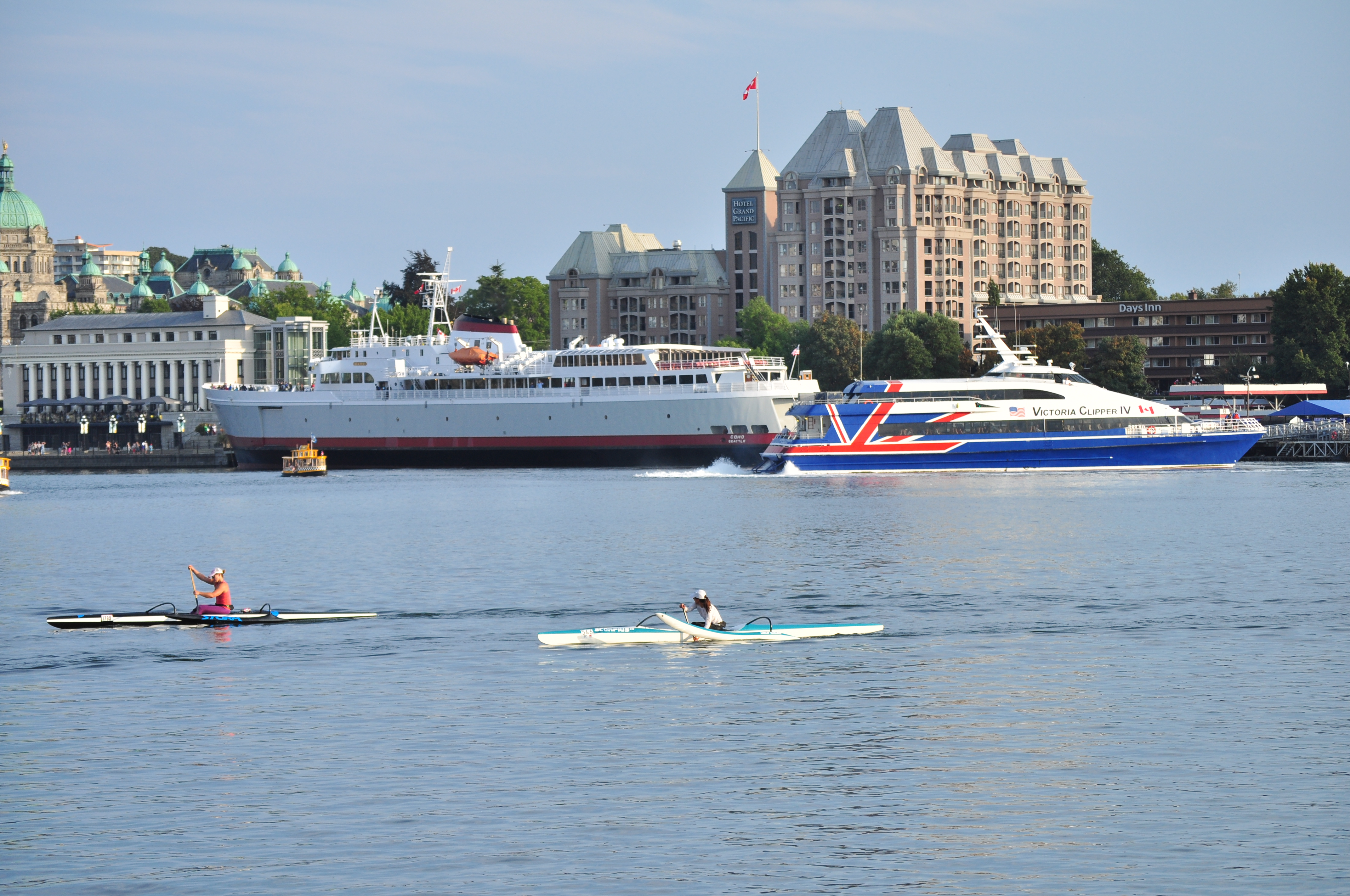 CPR Steamship Terminal, Victoria, British Columbia,  Black Ball Line's M/V Coho (which does the run from Victoria to Port Angeles, Washington), and Victoria Clipper IV (which does the run to Seattle) seen from the Delta Victoria Ocean Pointe across the Inner Harbour.