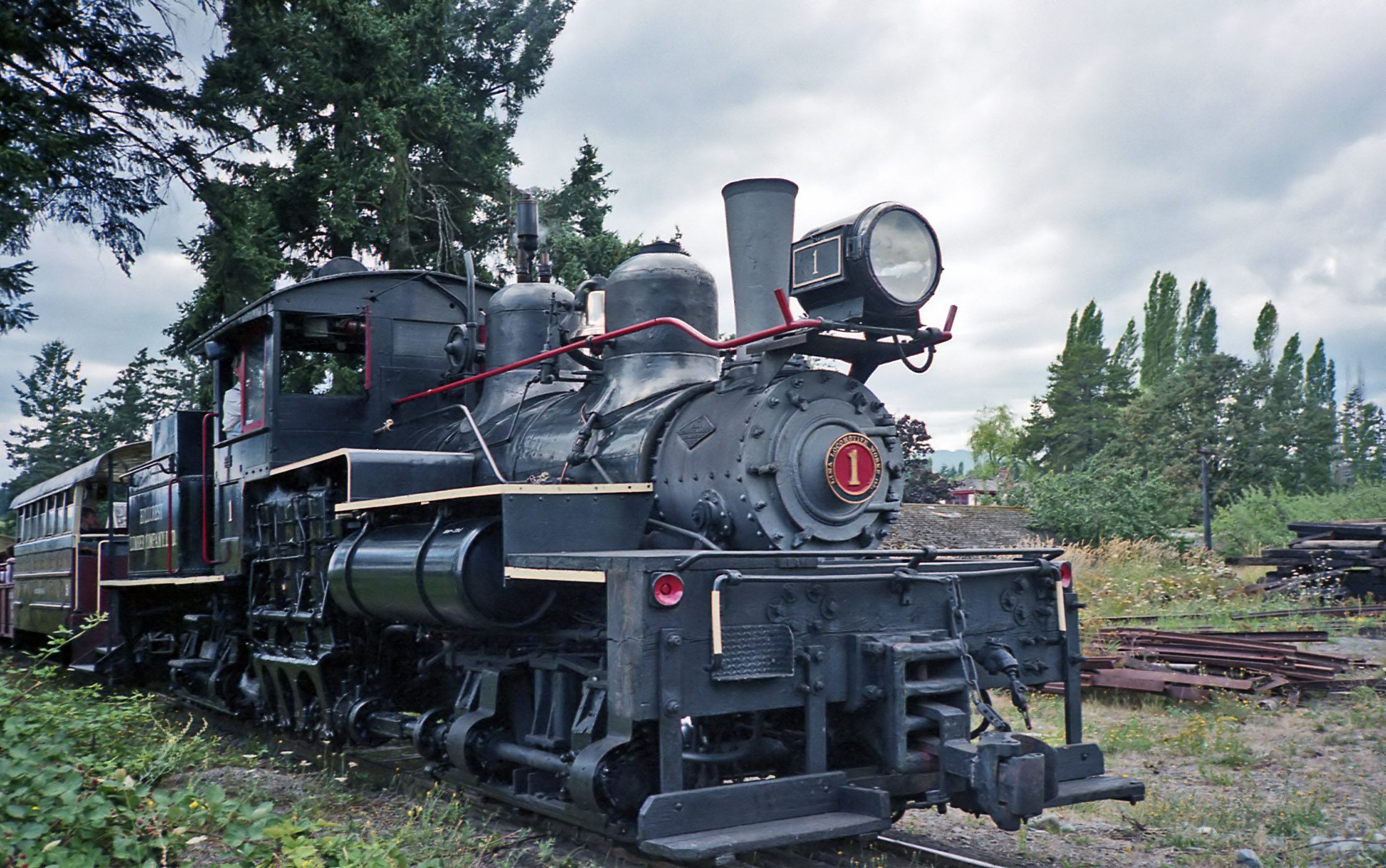 Hillcrest Lumber Company steam locomotive #1 (25-ton, 2-truck, 36" gauge Shay) pulls visitors around the BC Forest Museum (now BC Forest Discovery Centre) in Duncan, British Columbia on 16-July-1995.