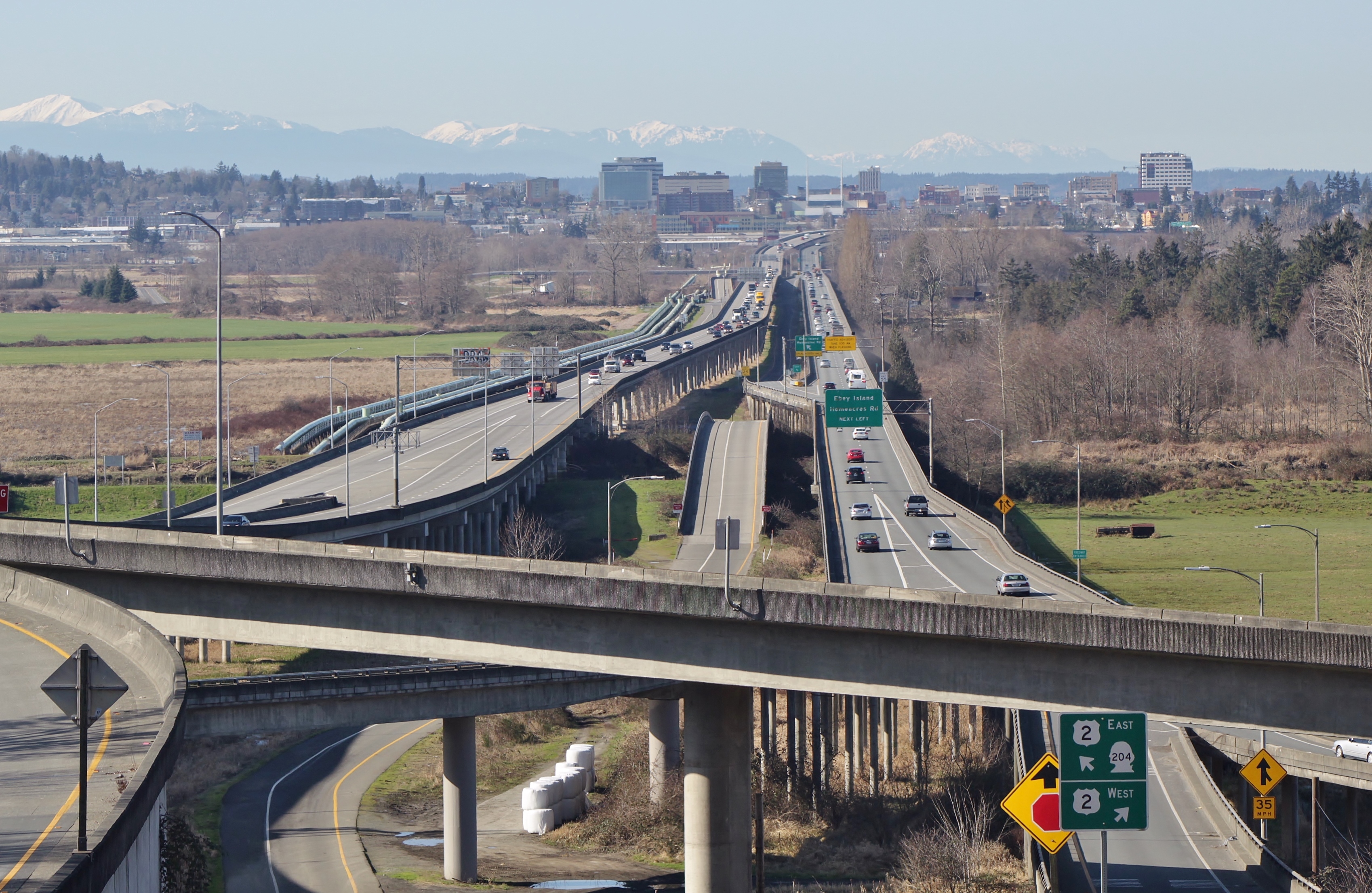 The Hewitt Avenue Trestle, carrying U.S. Route 2 across the Snohomish River Delta, seen from its east end near Lake Stevens. The skyline of Everett can be seen in the background.
