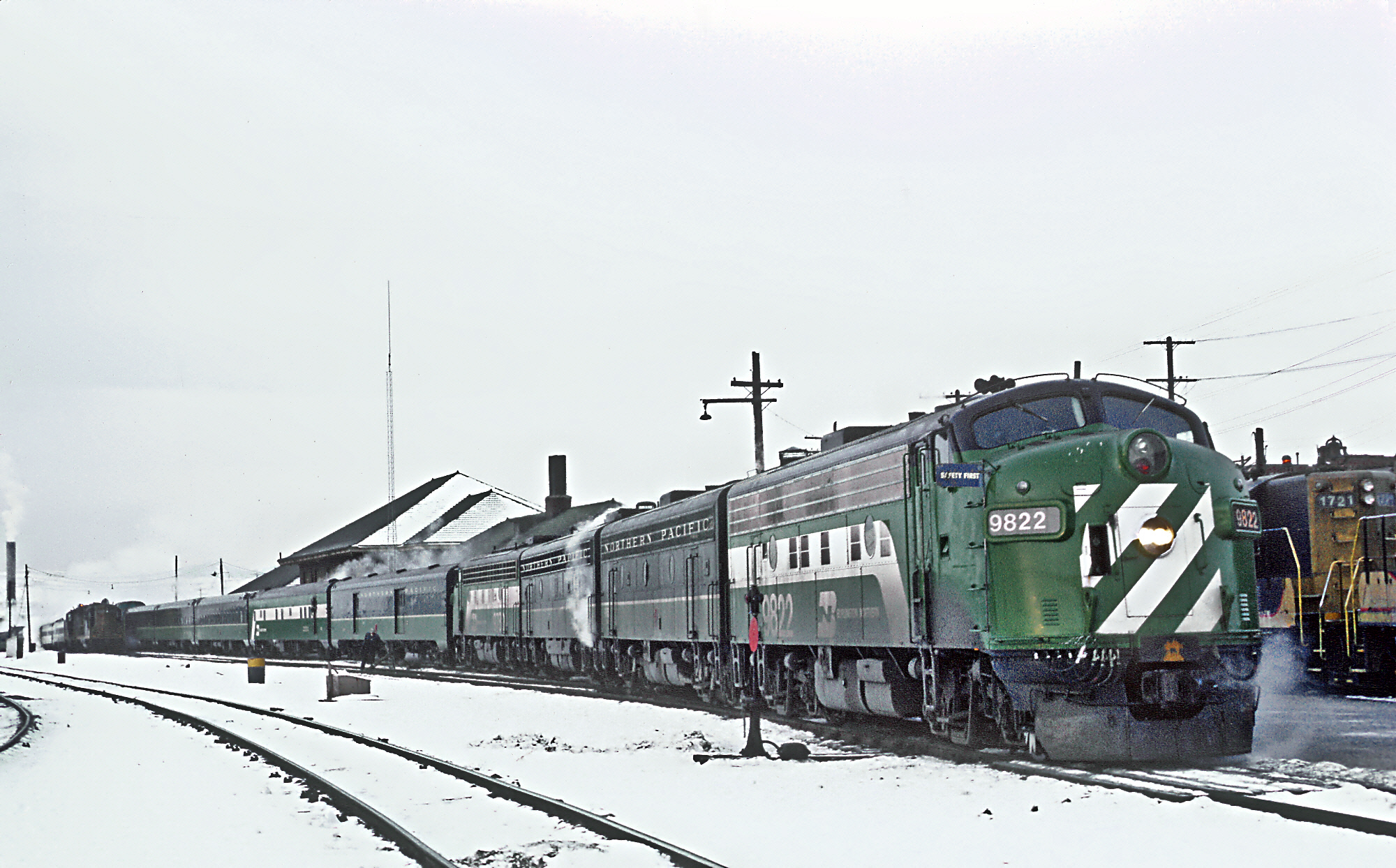 Burlington Northern 9822 (ex-NP 6705C) with Train 26, the North Coast Limited at Butte, MT on December 20, 1970.