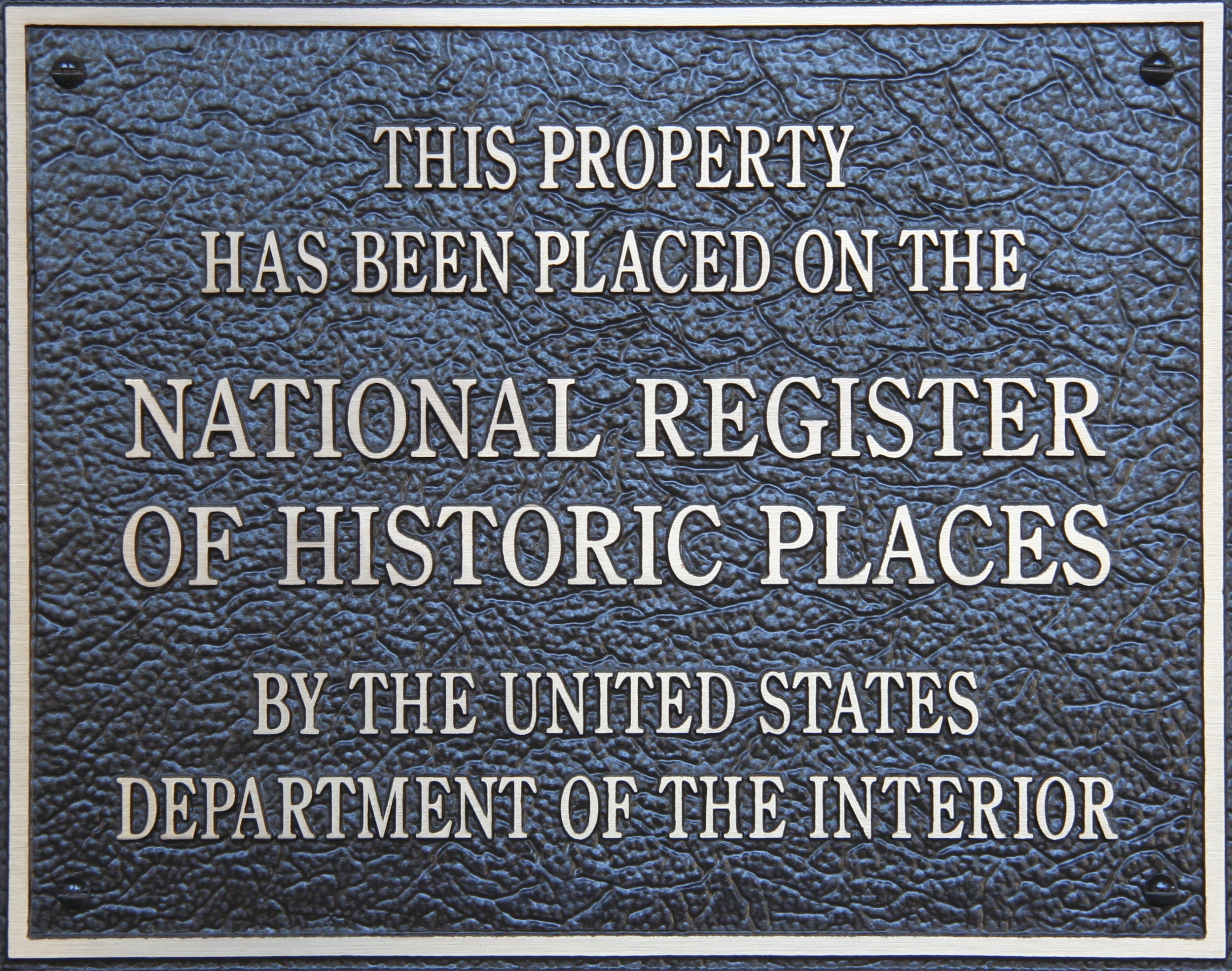 Plaque declaring "this property has been placed on the National Register of Historic Places by the United States Department of the Interior"