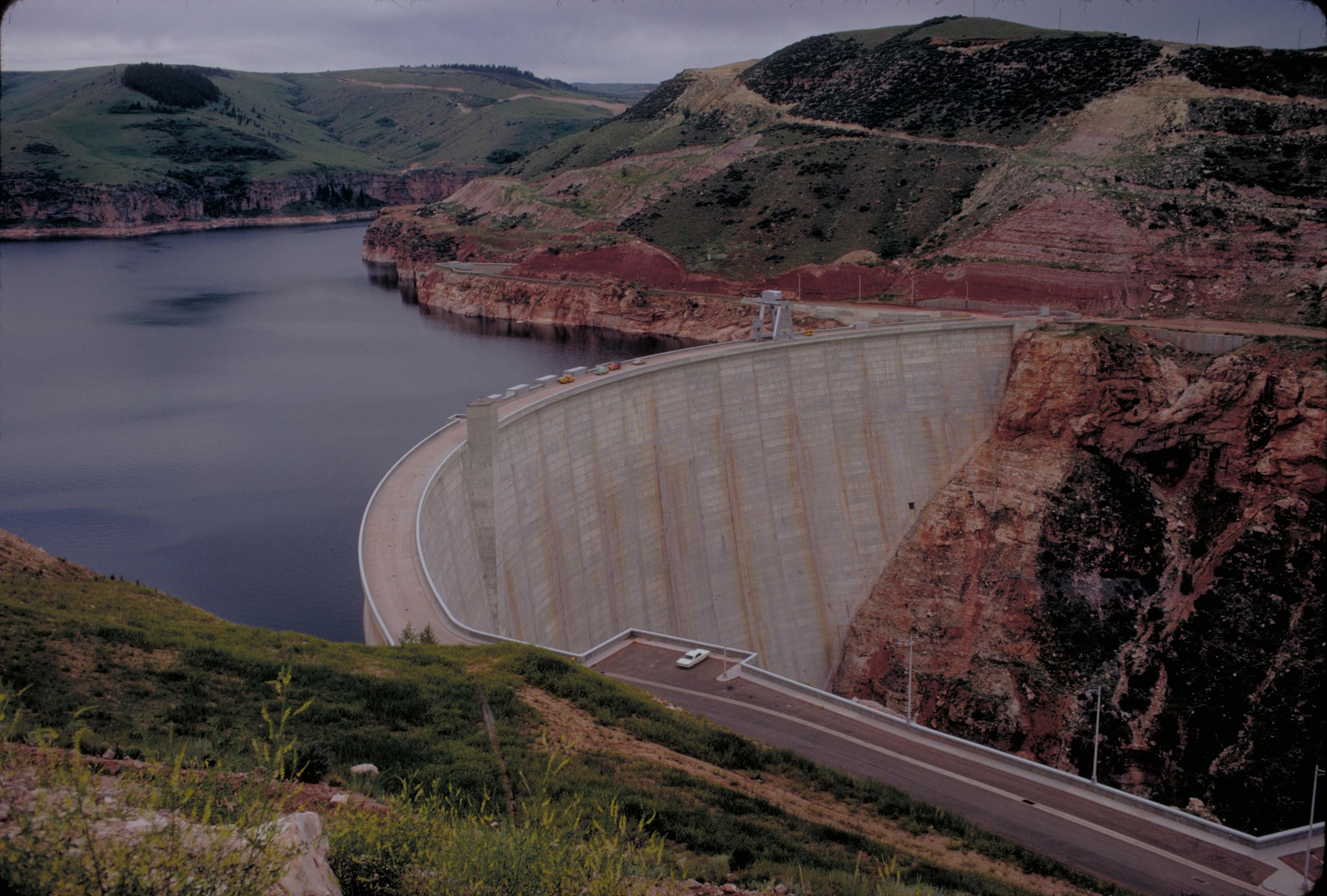 Yellowtail Dam
Bighorn Canyon National Recreation Area was established by an act of Congress on October 15, 1966, following the construction of the Yellowtail Dam by the Bureau of Reclamation. This dam, named after the famous Crow chairman Robert Yellowtail, harnessed the waters of the Bighorn River and turned this variable stream into a magnificent lake.
Bighorn Lake extends approximately 60 miles through Wyoming and Montana, 55 miles of which are held within spectacular Bighorn Canyon. The Recreation Area is composed of 70,000+ acres, which straddles the northern Wyoming and southern Montana borders. There are two visitor centers and other developed facilities in Fort Smith, Montana and near Lovell, Wyoming. The Afterbay Lake below the Yellowtail Dam is a good spot for trout fishing and wildlife viewing for ducks, geese and other animals. The Bighorn River below the Afterbay Dam is a world class trout fishing area.
Keywords: bica; Recreation areas; National parks and reserves; Canyons; Lakes