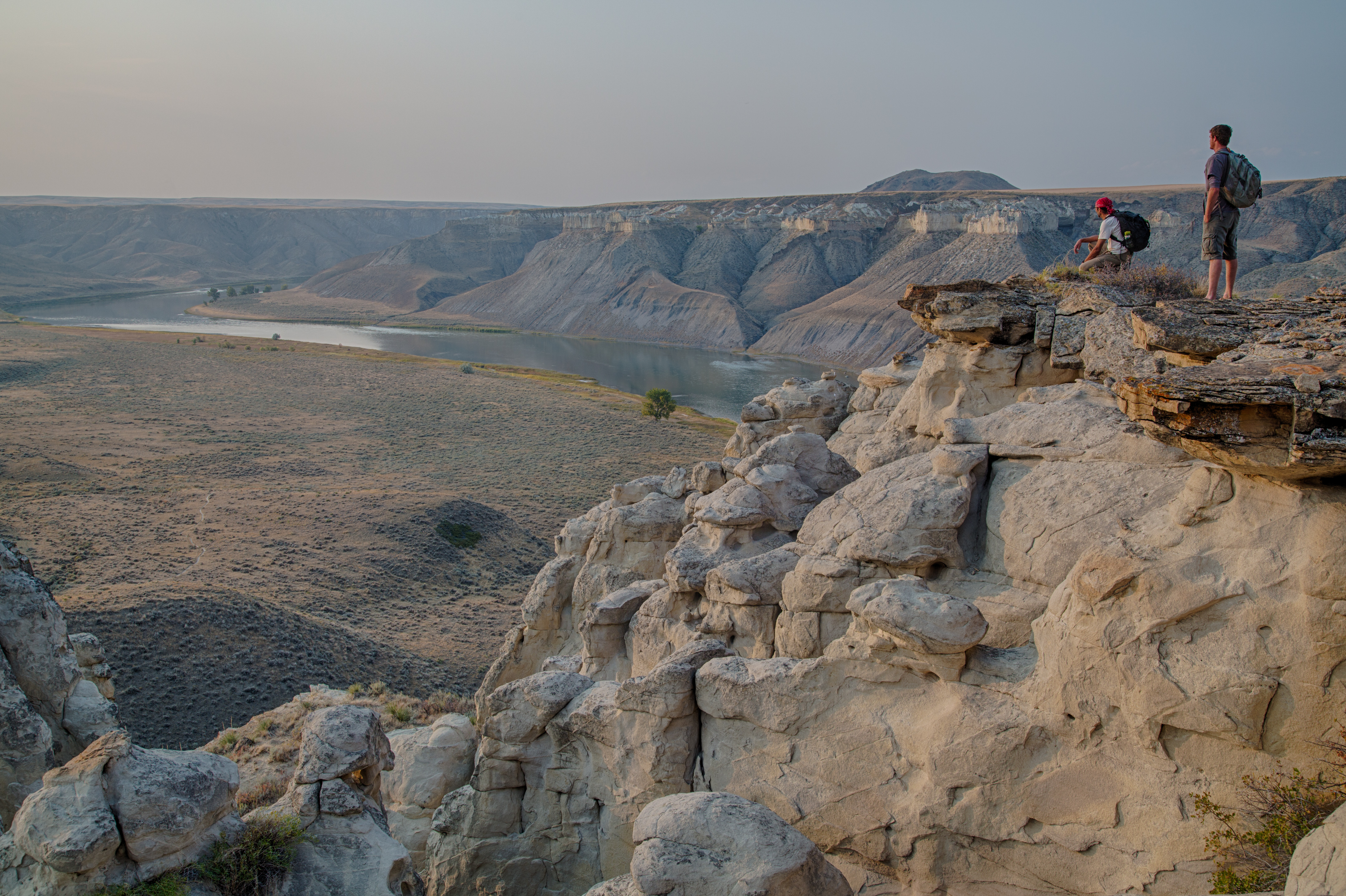Our July #conservationlands15 Bucket List Location: Take a step back in time and paddle through history along the BLM Upper Missouri Wild and Scenic River in Montana
“The hills and river Clifts which we passed today exhibit a most romantic appearance…. The bluffs of the river rise to hight of from 2 to 300 feet and in most places nearly perpendicular; they are formed of remarkable white sandstone which is sufficiently soft to give way readily to the impression of water…” Meriwether Lewis,  May 31, 1805.
You can camp in the same locations as the 1805 Lewis and Clark expedition on your multi-day canoe expedition down the “Big Muddy”.  The river is a relatively easy paddle with current and riffles but no major rapids. Along the way, camp under the shade of spreading cottonwoods and try your luck catching a paddlefish – some weigh over 100 pounds.  The Breaks Country surrounding the river offers opportunities for scrambles and cross country hikes to the bluffs above.  
The unique geology and harsh landscapes that were extensively described by Lewis and Clark are in a condition that has changed little since the passage of the expedition.   Historic homesteads dot the river banks, and remnants of the steamboat era remain in inscriptions that were etched on the rock walls.  

Photo by Bob Wick, BLM