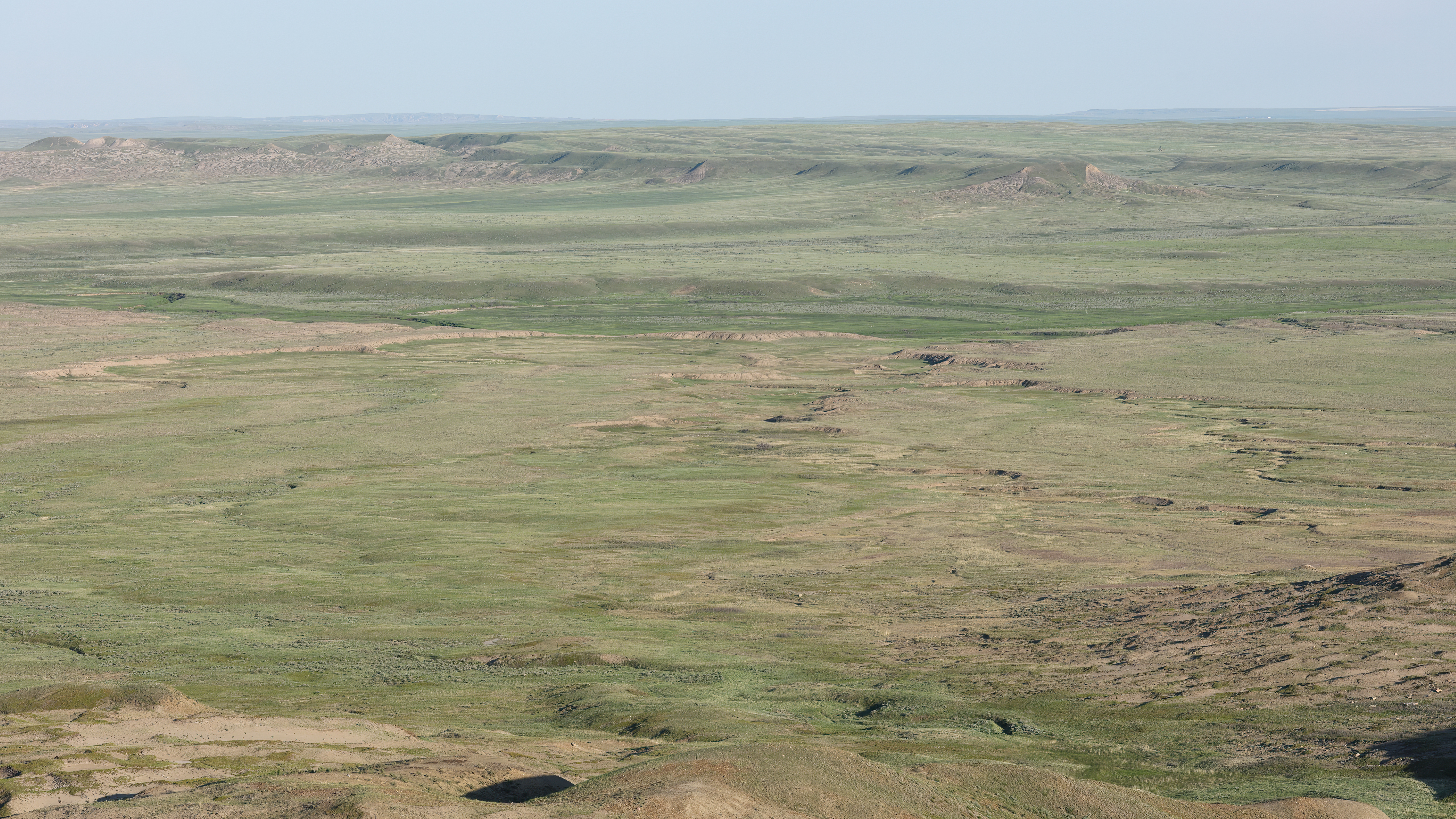 Grasslands National Park view 70 Mile Butte, Saskatchewan, Canada. In the center of this valley stand out the verdant banks of the Frenchman River
