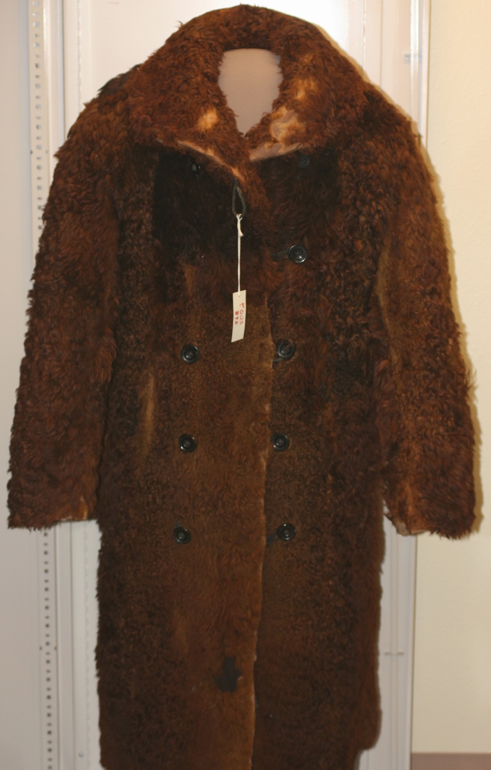 Buffalo robe coat.
During the fur trade, on average about 25,000 buffalo robes were sent down river each year to the major commercial centers. The robes were then used as blankets, padding in carriages and made into buffalo coats like the one pictured here. 
(received as gift)
Keywords: fort; union; trading; post; national; historic; site; artifacts; trade; plains; indians; american; artifact
