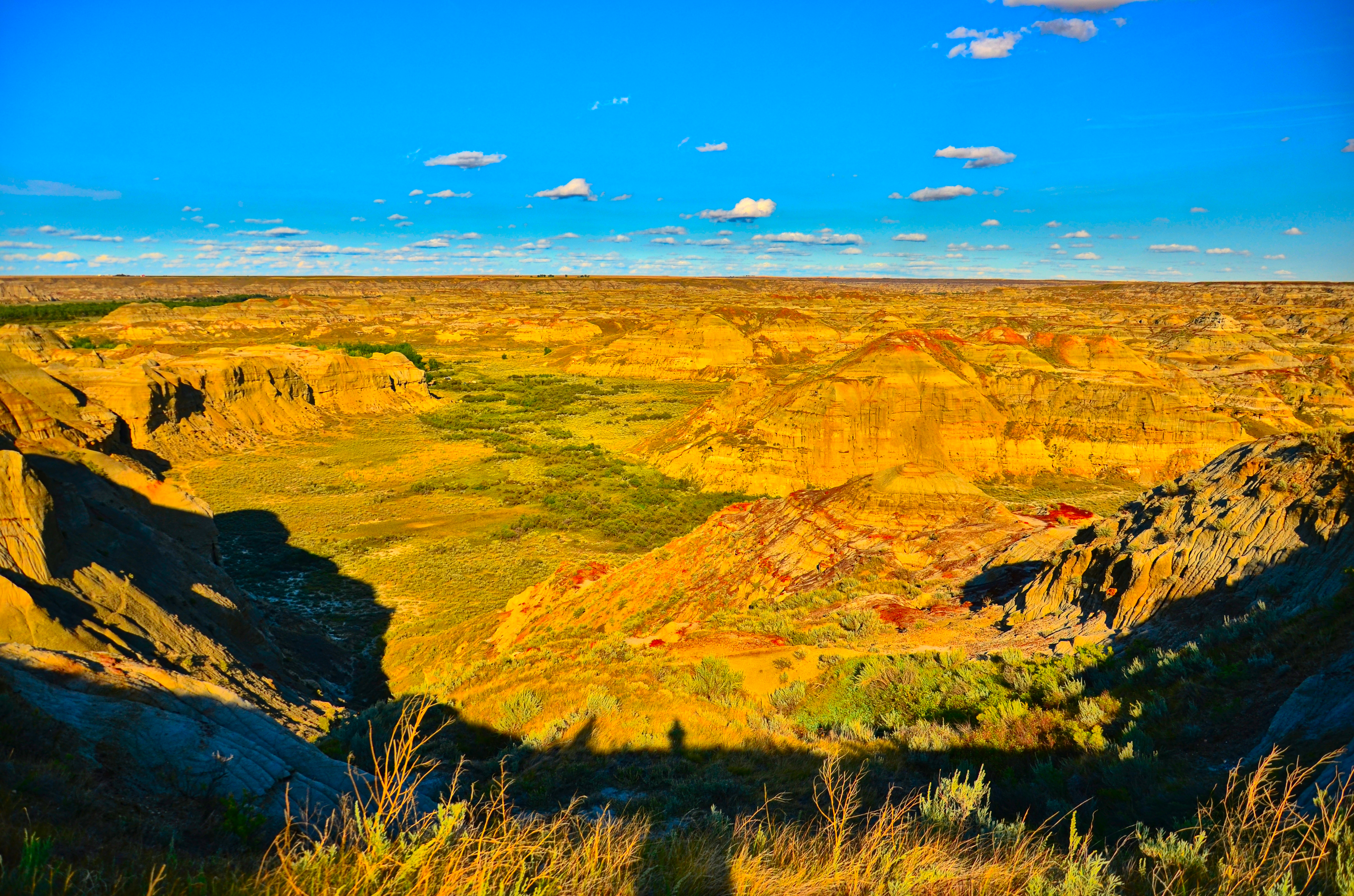 A rugged Red Deer River valley landscape, as viewed from an overlook point just before sunset in Dinosaur Provincial Park, Alberta.