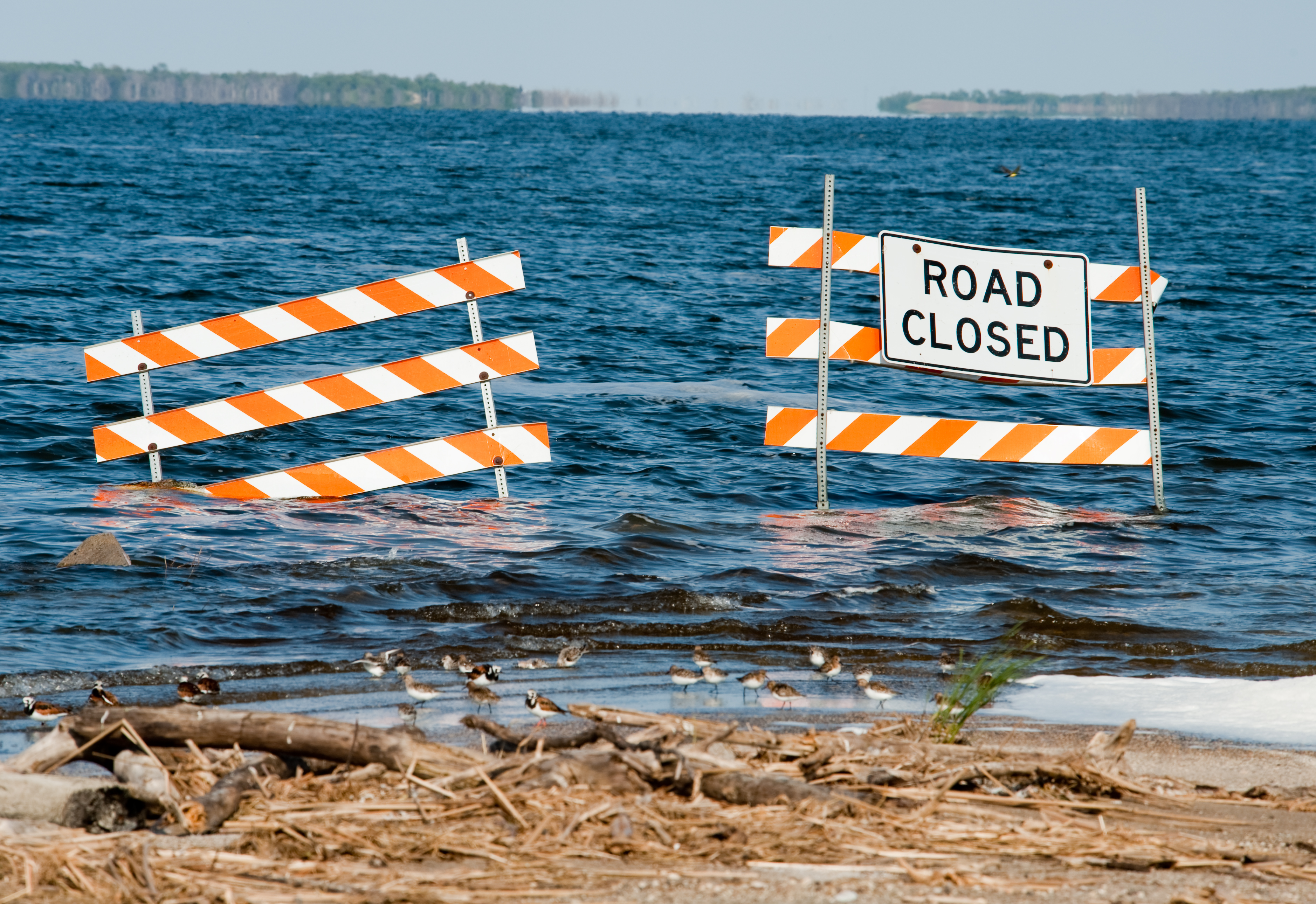 Devil's Lake, ND, June 5, 2009 -- A  road is covered with water from Spirit Lake.  The saltwater lake has been steadily rising for the last several years, threatening homes and businesses in the area.  Photograph by Samir Valeja/FEMA