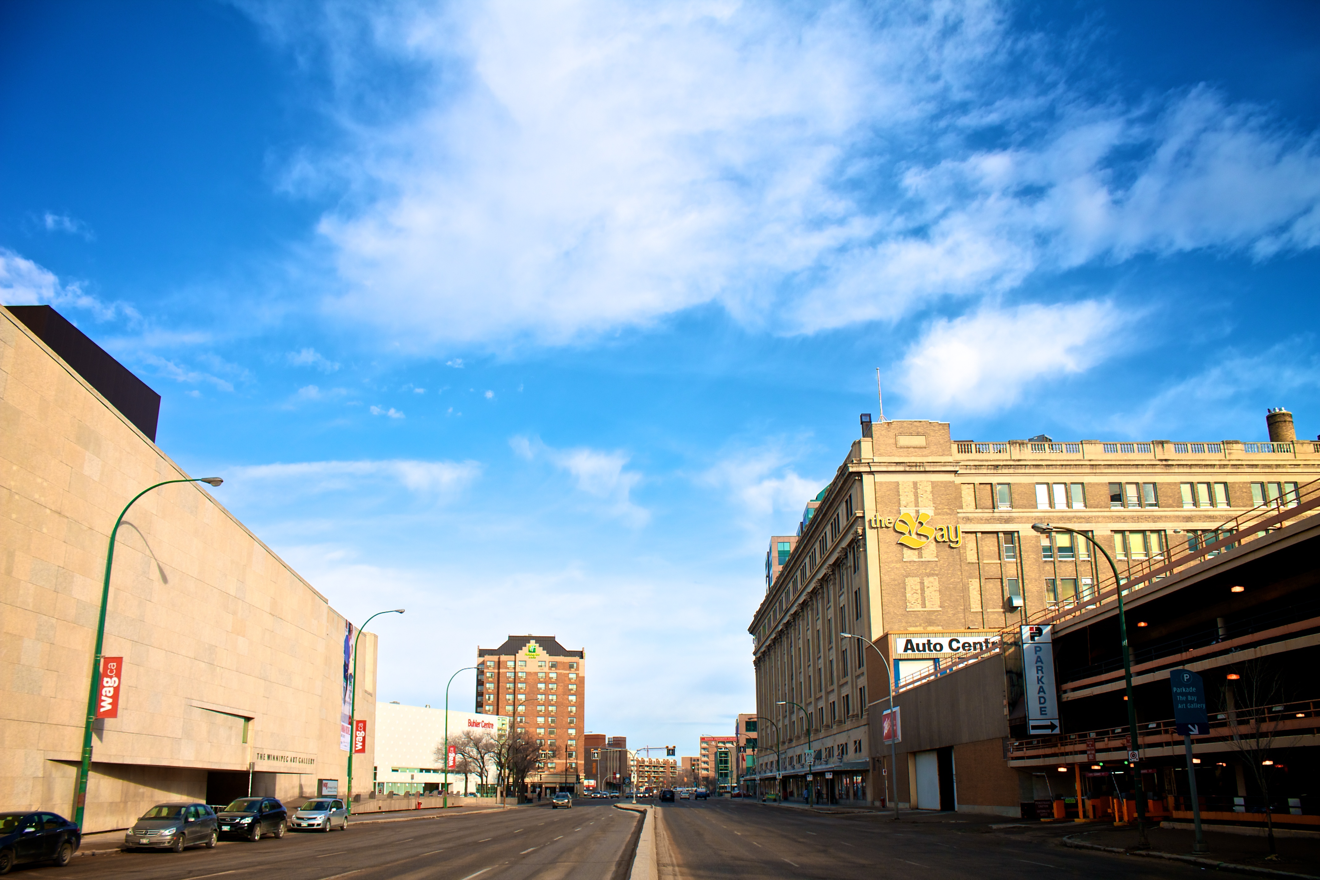 Memorial Boulevard in Winnipeg, Manitoba, with WAG (Winnipeg Art Gallery) on the left and the Hudson's Bay Company store on the right.