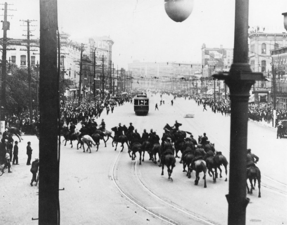 Royal North West Mounted Police operations in Winnipeg General Strike, 1919; turning left on William Street towards City Hall, shortly before firing into the crowd (Horrall 1973, p.178)