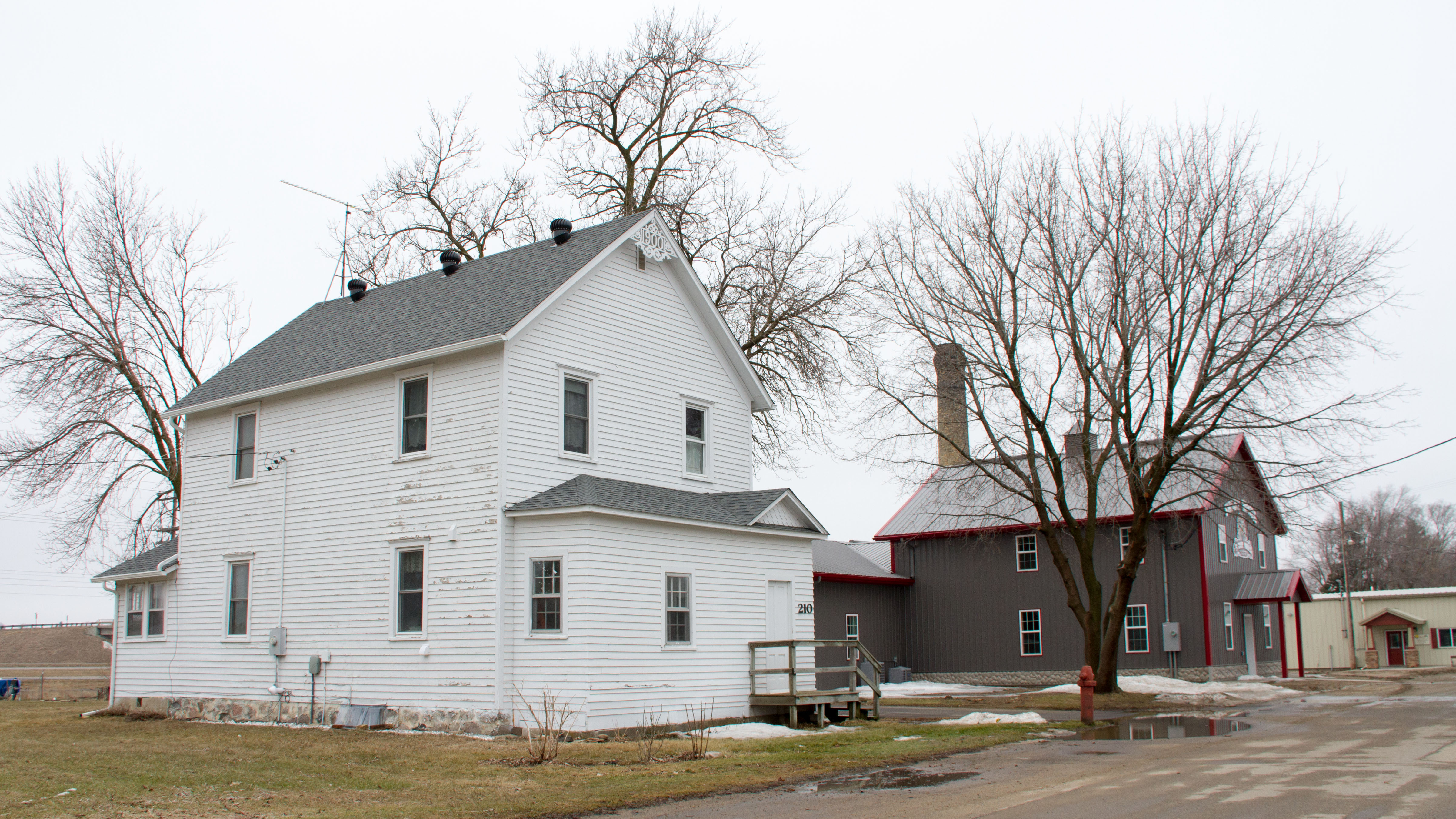 What remains of the Freeport Roller Mill and Miller's House in Freeport, Minnesota, USA. The house remains standing, but the original mill (also known as the Swany White Mill) burned down on December 27, 2011 and all that remains is the stone chimney in the background; the gray building in between is not a part of the NRHP listing.