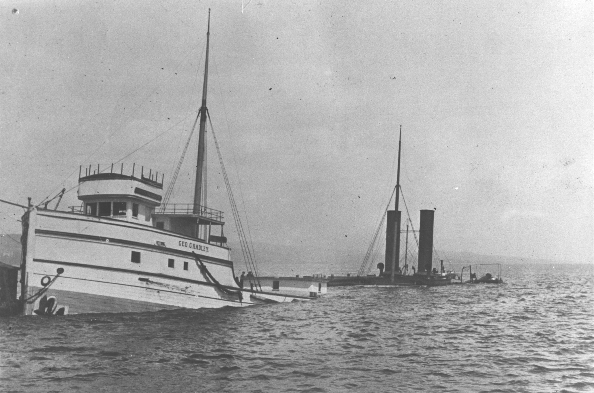 A photo of the George G. Hadley following a collision with the Thomas Wilson in the Duluth Shipping Canal  on June 7, 1902. The Hadley settled to the bottom in the shallows off Minnesota Point and was recovered and repaired.