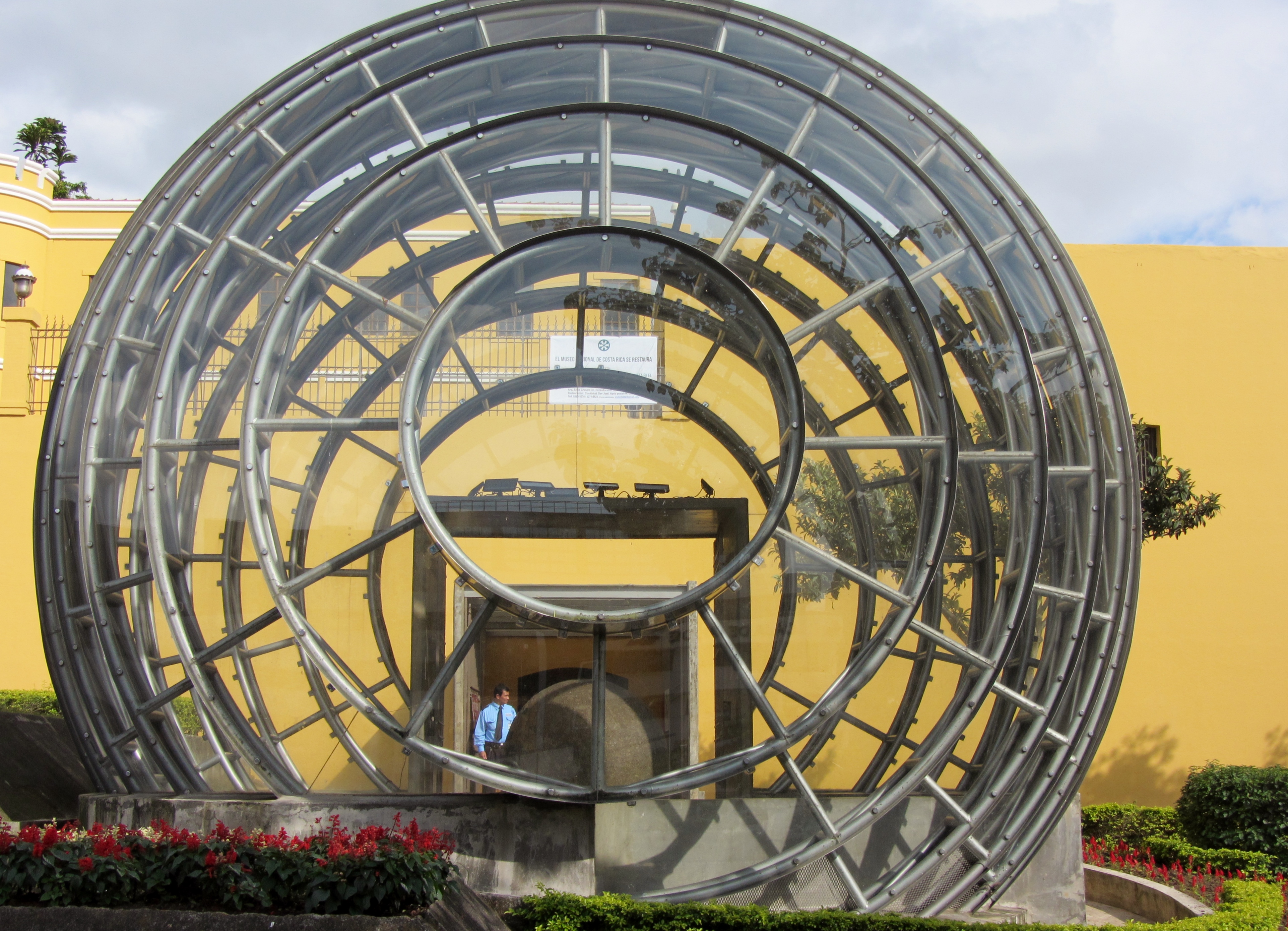 Authentic Diquís stone sphere exhibited inside the glass and metal sphere built in the Plaza de la Democracia, in front of the new main entrance of the National Museum of Costa Rica, and which functions as a museum lobby