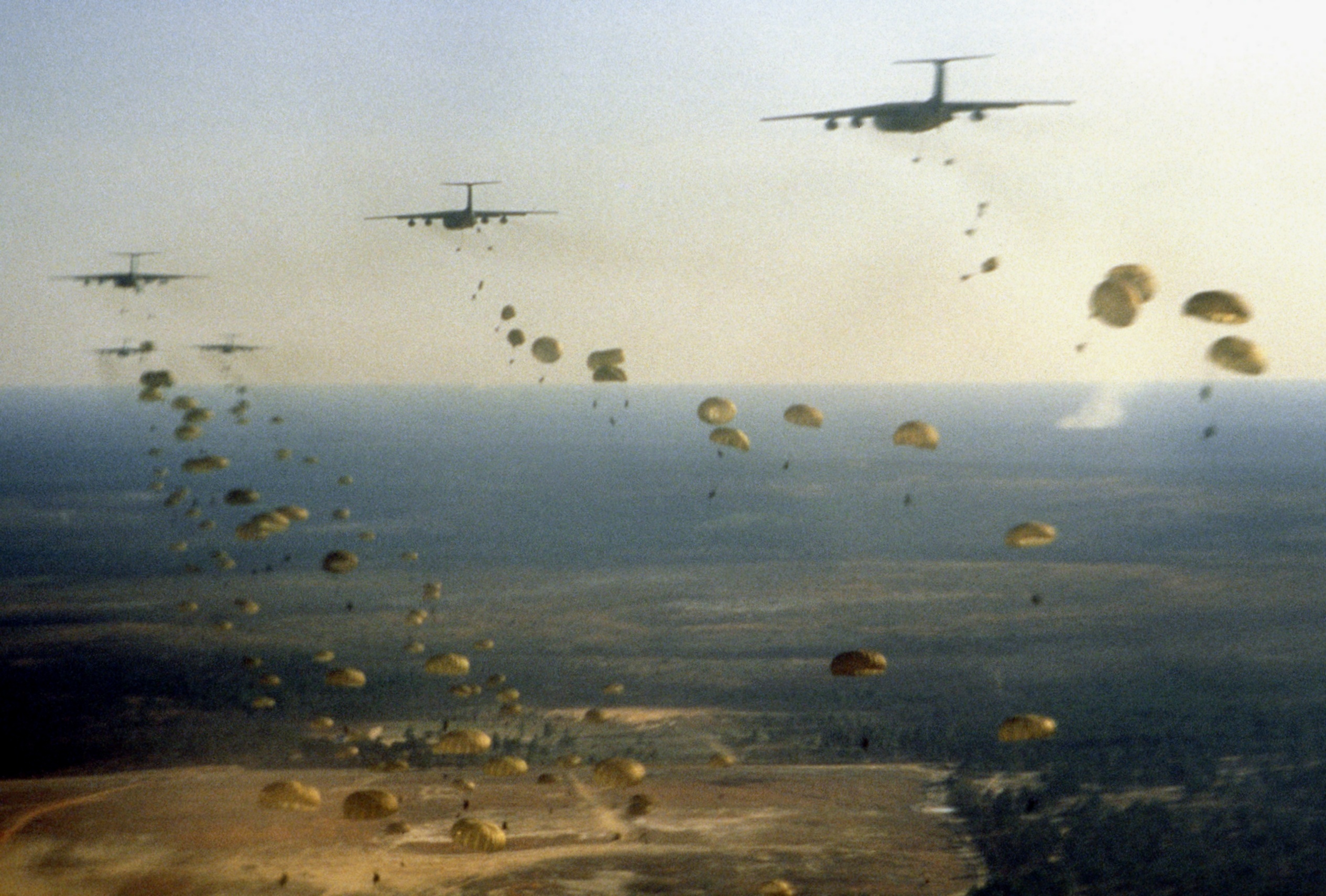 Members of the U.S. Army 1st and 2nd Battalions, 504th Parachute Infantry Regiment, 82nd Airborne Division jump from USAF Lockheed C-141B Starlifter aircraft on 1 March 1988. U.S. troops spent two weeks participating in a mobilization of U.S. exercise task force Dragon/Golden Pheasant. U.S. President Ronald Reagan mobilized U.S. forces, consisting of both the 82nd Airborne Division and the 7th Light Infantry Division, to help discourage Nicaraguan forces from entering Honduras.
