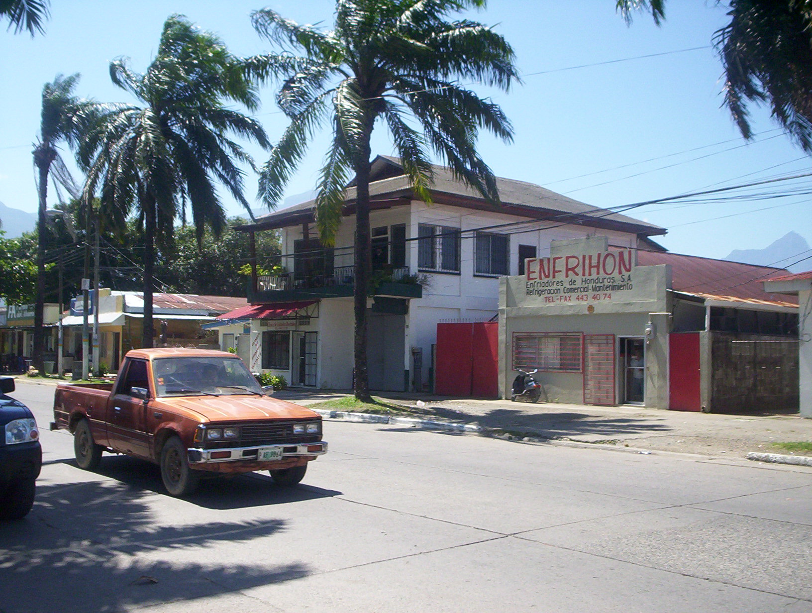 Buildings in La Ceiba, with Pico Bonito in the background — Honduras.