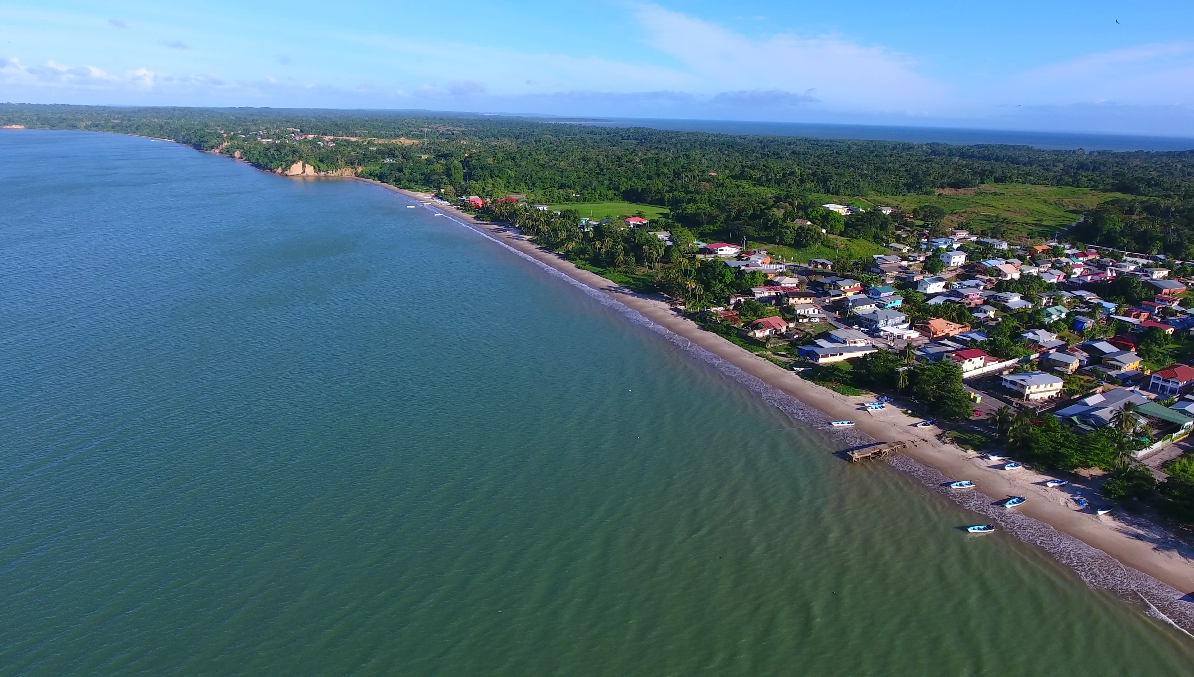 Cedros Bay, Gulf of Paria.
Village: Cedros, Siparia, Trinidad and Tobago. Water body in the background: Islote Bay (Columbus Channel/Boca del Serpiente).

Photo taken as part of the Southern Trinidad Aerial Photo Project, a small project sponsored by WMDE. Drone used: DJI Phantom 4. Snapshot taken from video footage via VLC.