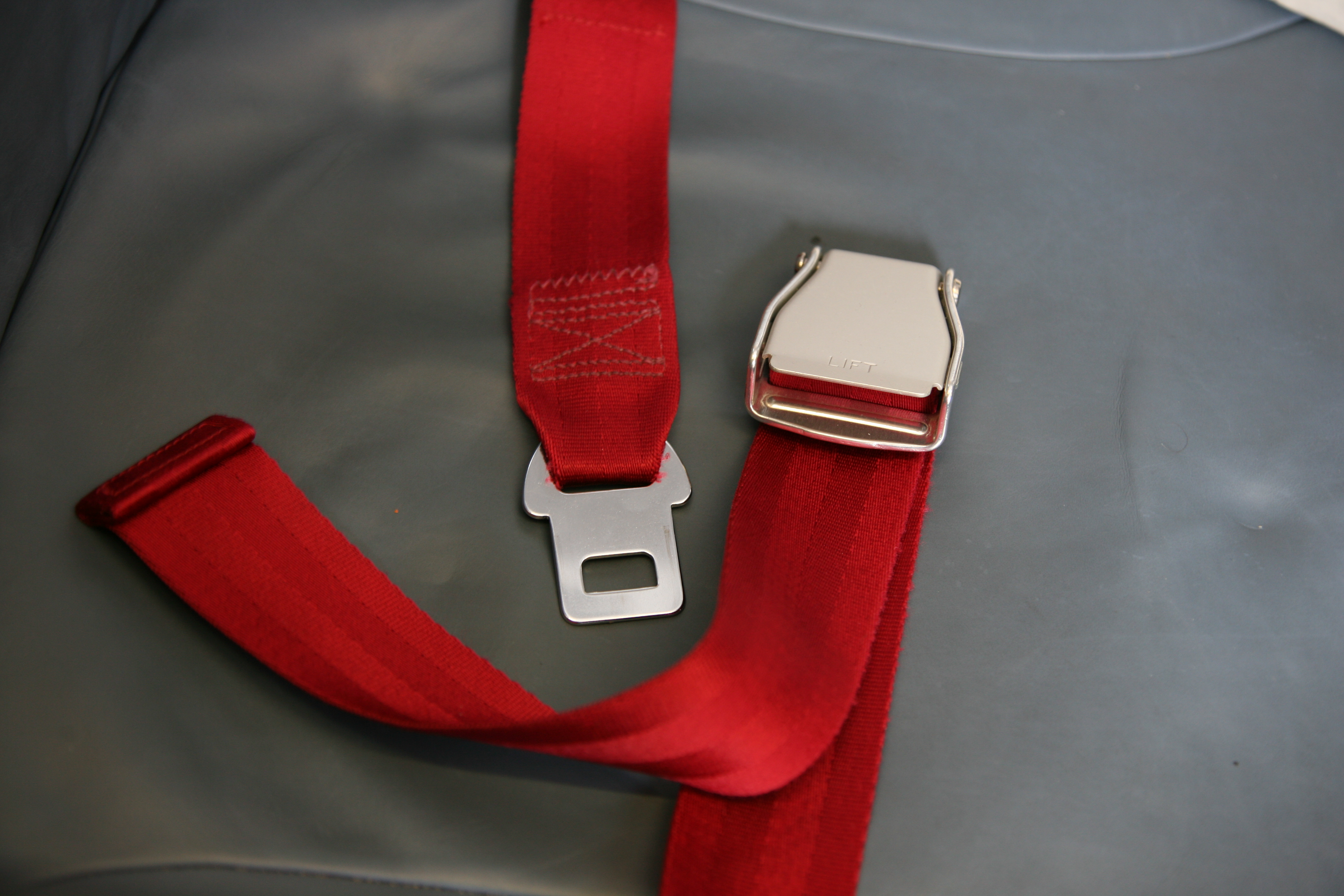 Seat belt on an airplane, open