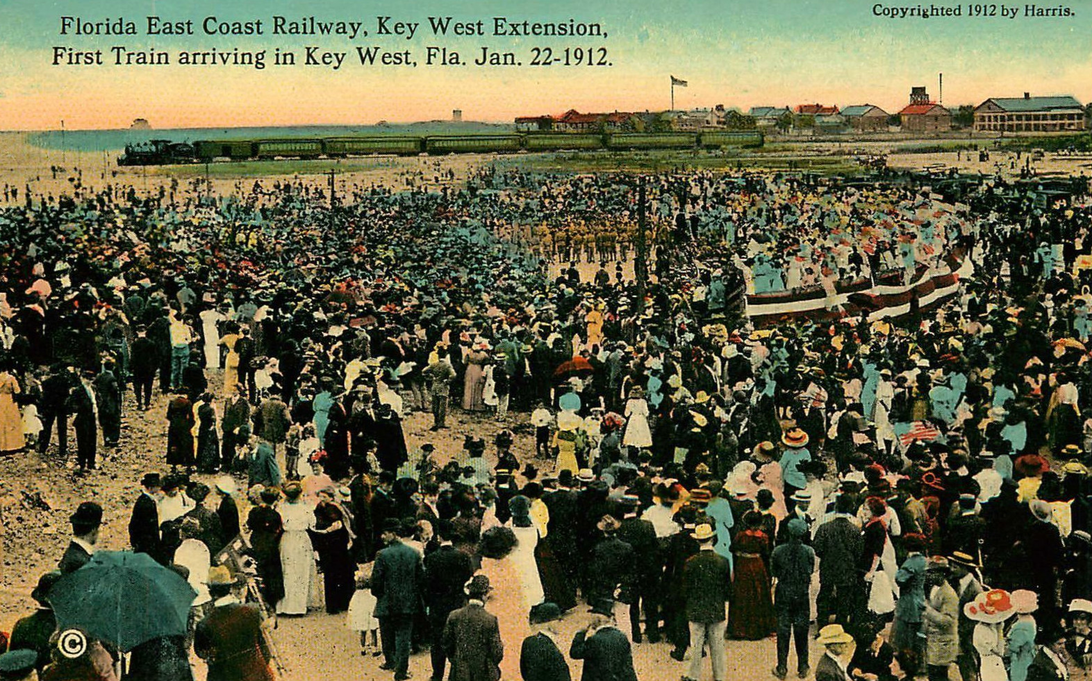 Color tinted postcard photo of the Florida East Coast Railway's first train arriving at Key West, Florida, on 22 January 1912.  The first train carried the railroad's president and financier, Henry M. Flagler, in his private car.