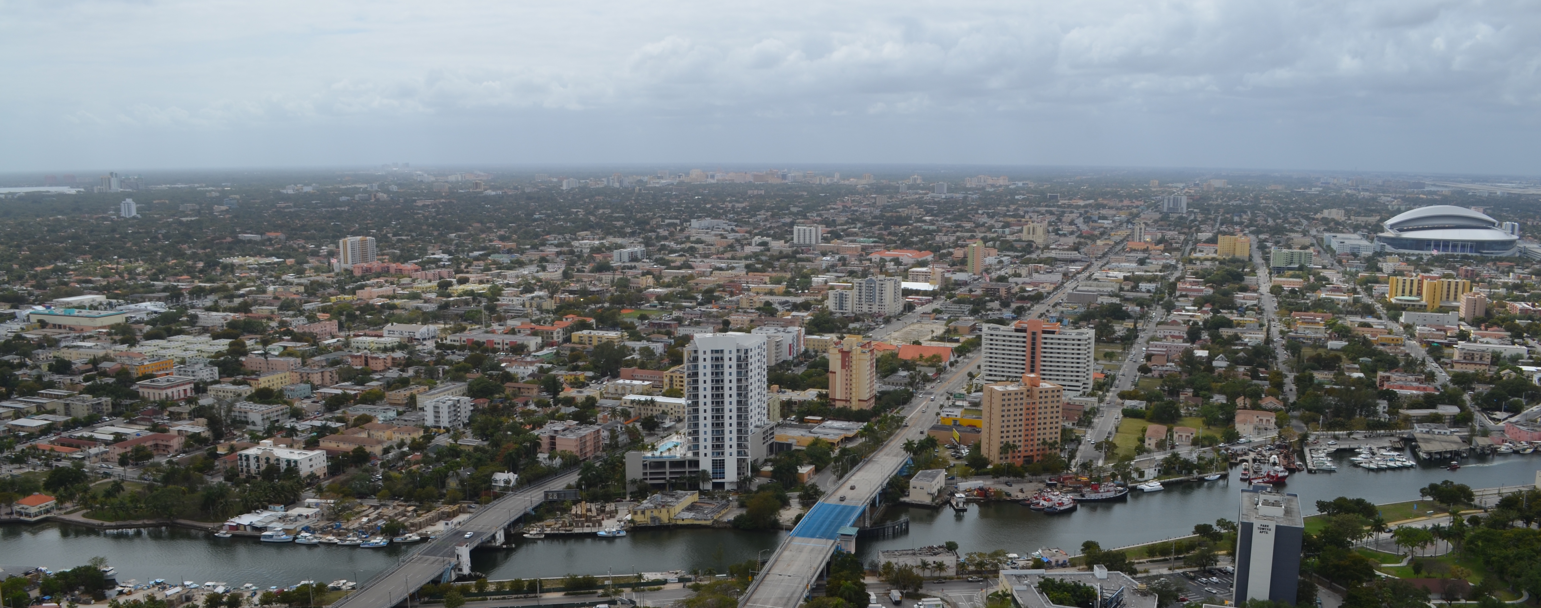 Aerial view of en:Little Havana en:Neighborhoods of Miami. At right is en:Marlins Park, in the background en:Coral Gables skyline can be seen, to the very left is en:Coconut Grove.