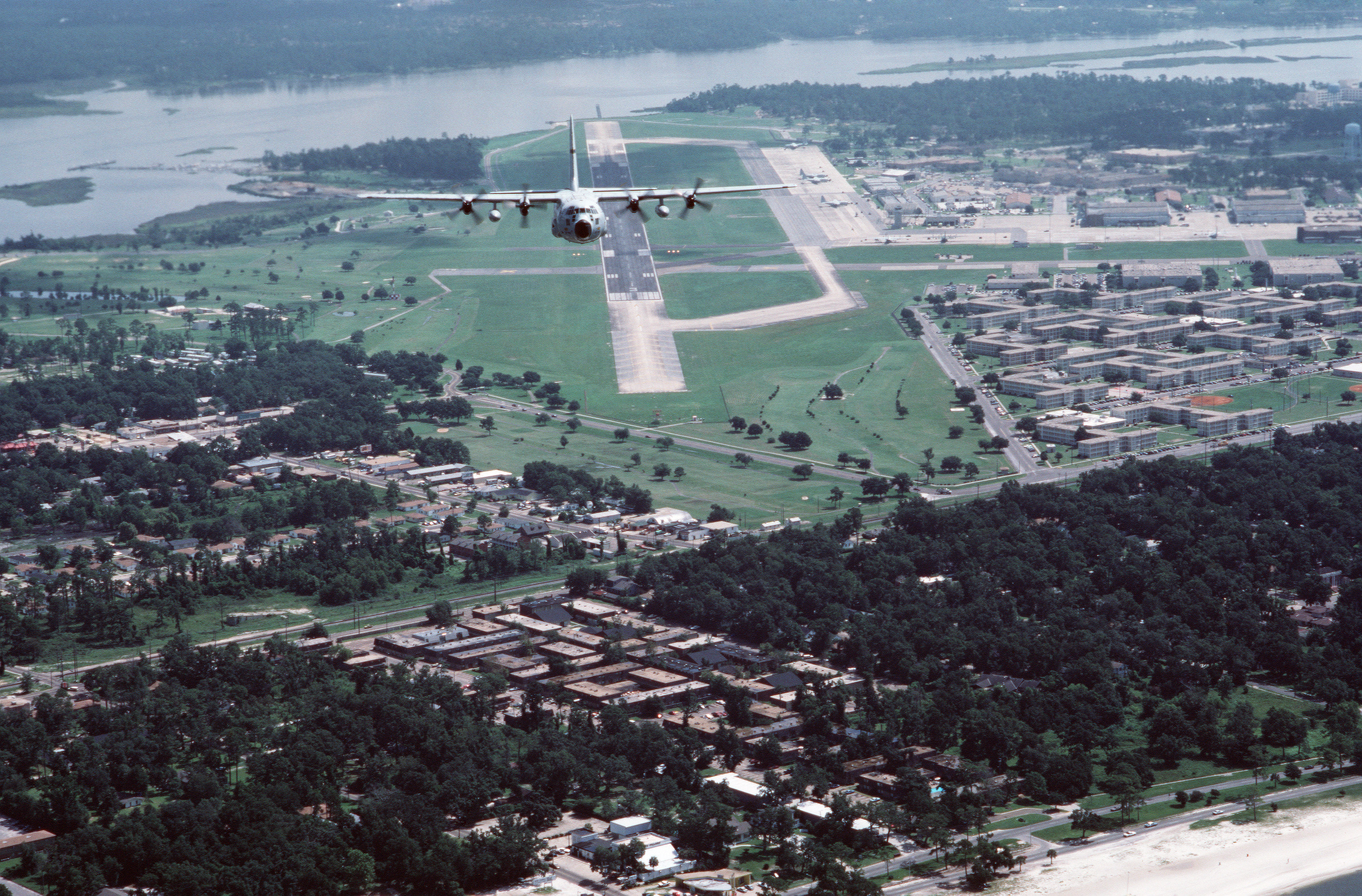 A U.S. Air Force Lockheed WC-130H Hercules aircraft in flight over Keesler AFB, Mississippi (USA).