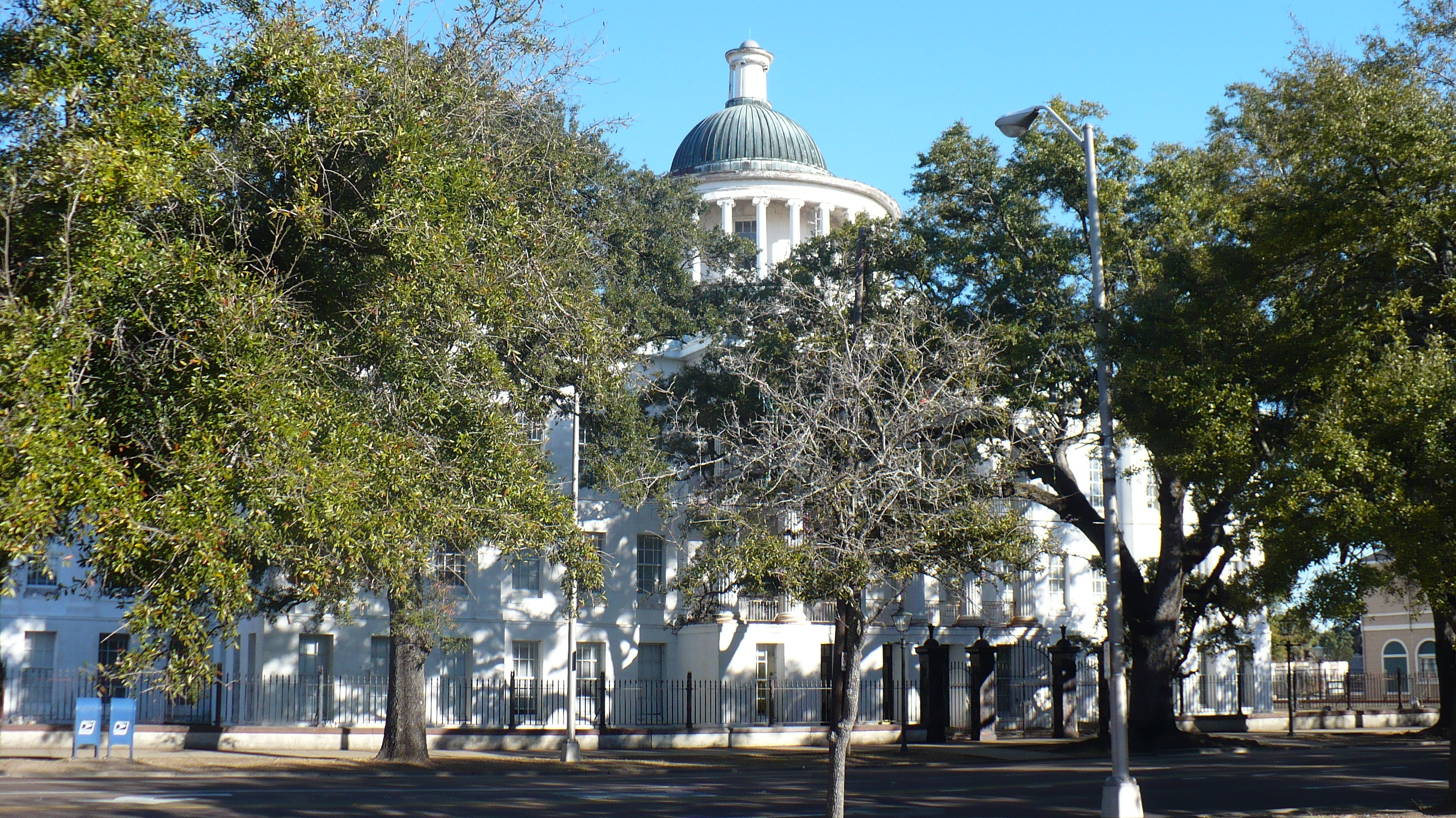 Barton Academy in Mobile, Alabama.  Partially obscured by live oaks (Quercus virginiana).