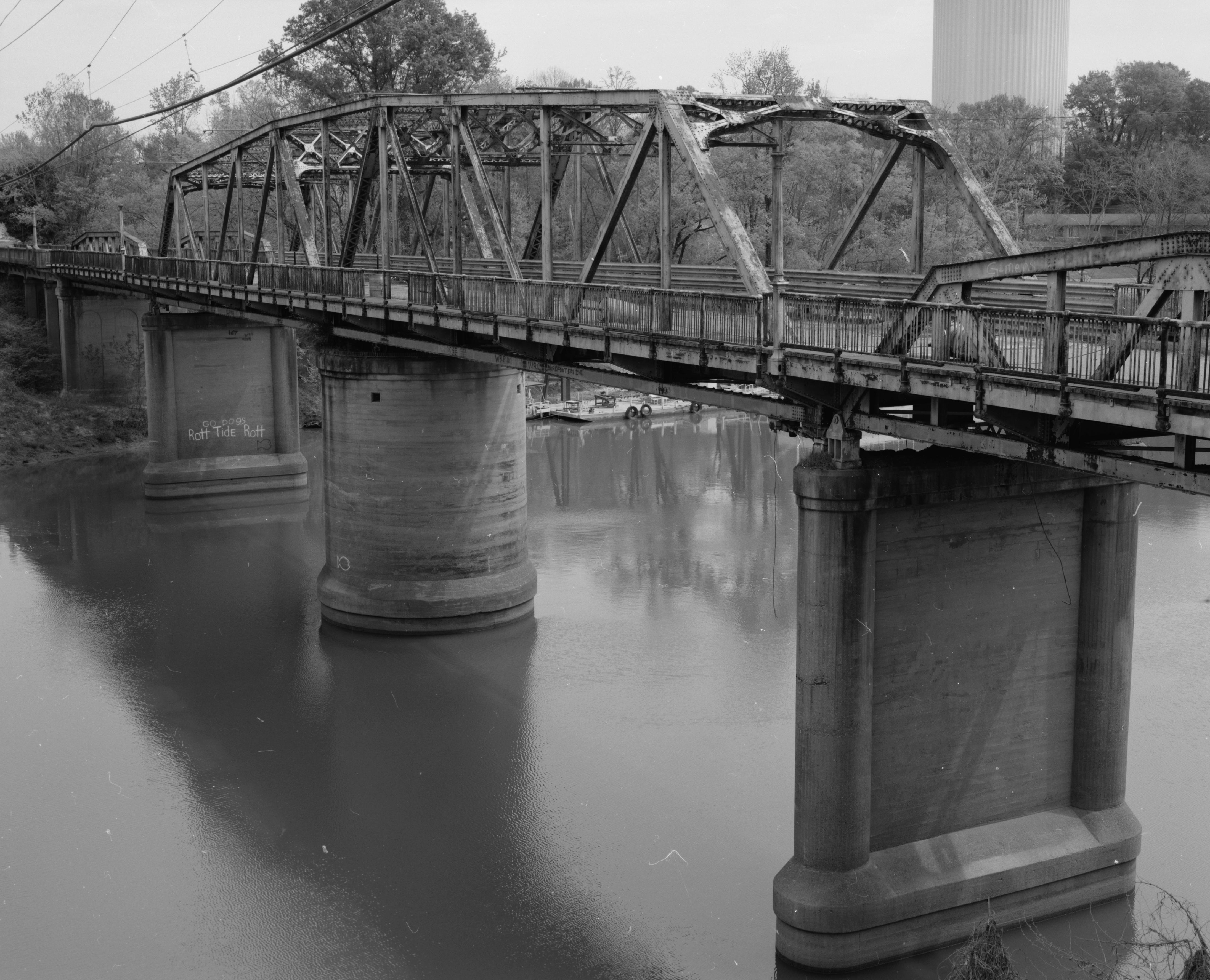Southern (upstream) side of the Columbus Bridge, which once carried U.S. Route 82 over the Tombigbee River at Columbus, Mississippi, United States.  Built in 1925, it is listed on the National Register of Historic Places.
