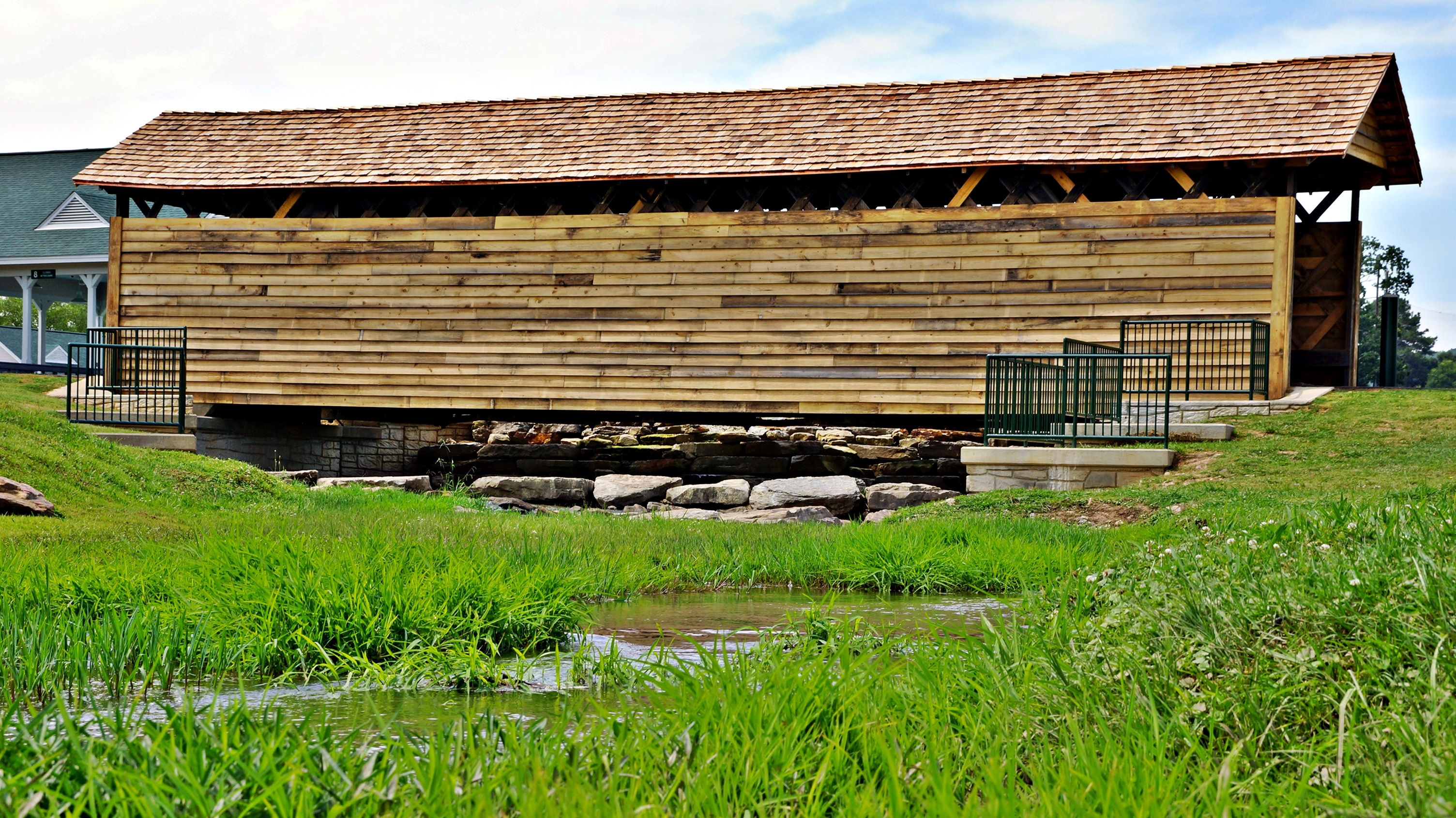 Coldwater covered Bridge Oxford,Alabama.  Built in 1850, the 63 foot bridge was moved to Oxford from nearby Coldwater and restored to preserve the landmark that is listed on the National Register of Historic Places.  It currently spans a small outflow from the Oxford Lake and is maintained by the city.