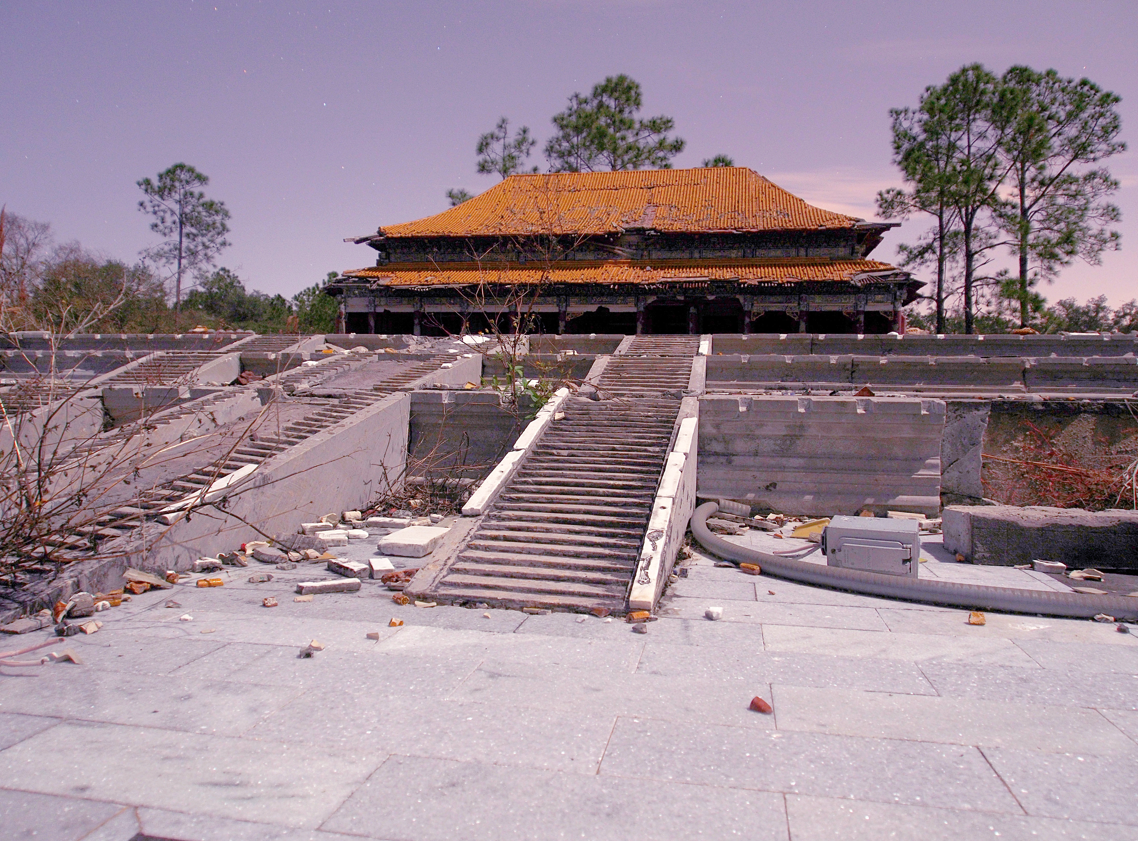 On a recent family trip to Orlando, I noticed that we were staying right around the corner from the abandoned theme park Splendid China.
How could I pass up an opportunity to head in for some photos?!

The park was built in 1993 at a cost of ~$100m, and closed 10 years later (2003).  So here is what it looks like as it slowly rots in the Florida sun almost 10 years later...