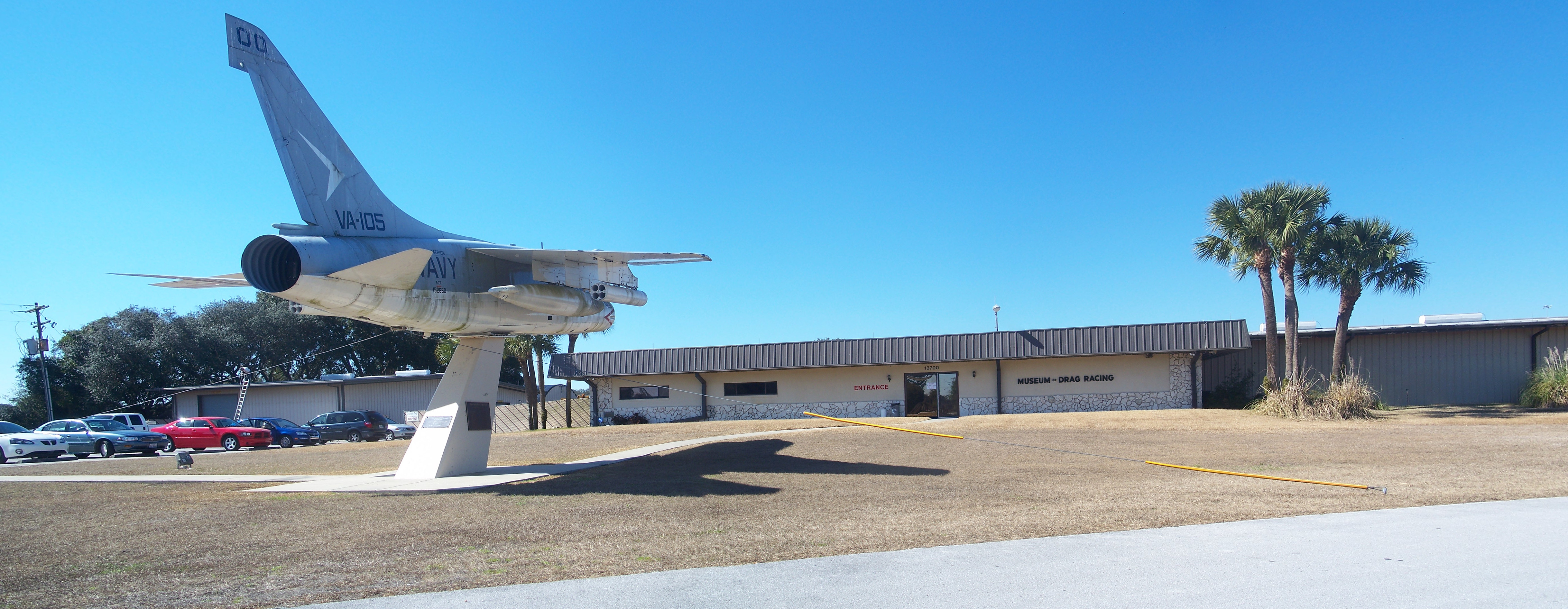 Marion County, Florida: Belleview: Don Garlits Museum of Drag Racing: 

Panorama view. Includes Museum of Drag Racing building on right, and Vought A7A Corsair II BuNo 152650 on left.