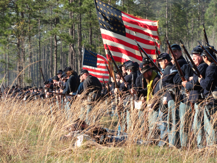 Reenactor's depict the Federal battle line. Olustee Battlefield, 2 miles east of Olustee on U.S. Route 90 in the Osceola National Forest Olustee
On February 20, 1864, more than 11,000 cavalry, infantry and artillery troops fought a five-hour battle in a pine forest near a railroad station called Olustee, Florida. The four hour battle ended in defeat for the Union troops and preserved Confederate control of the interior and the capital of Florida until the war ended. Tallahassee was the only Confederate capital east of the Mississippi River not taken by the Federal Armies.