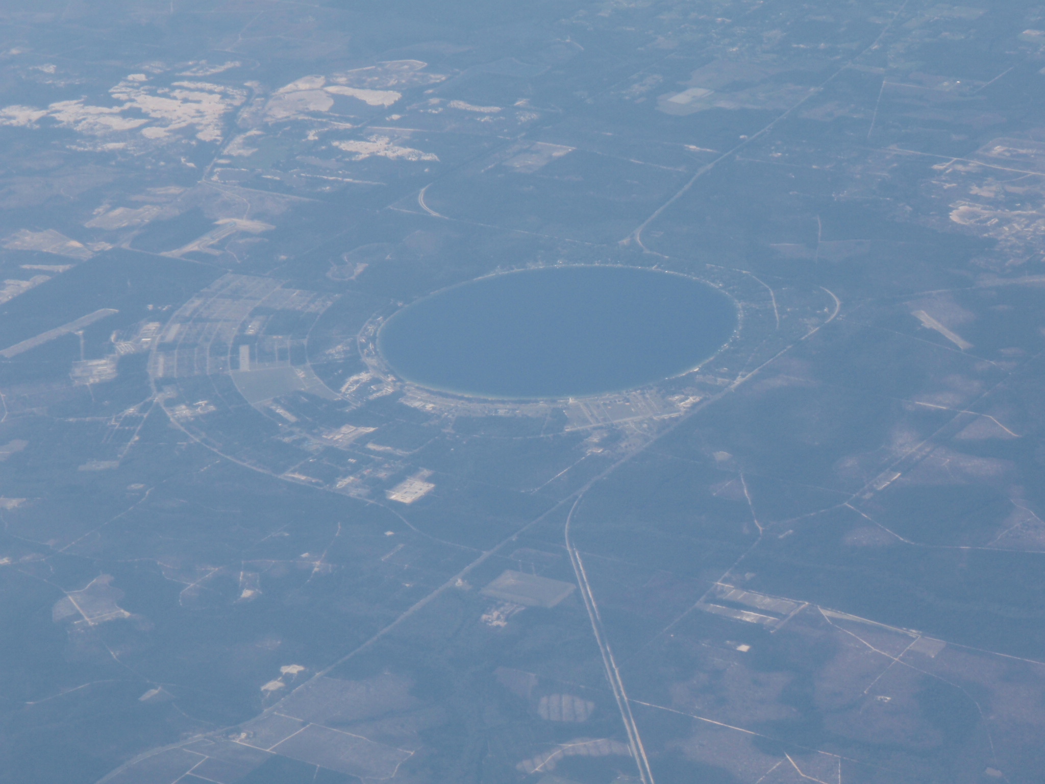 A circular-shaped artificial lake taken on a plane somewhere over Virginia/North Carolina.