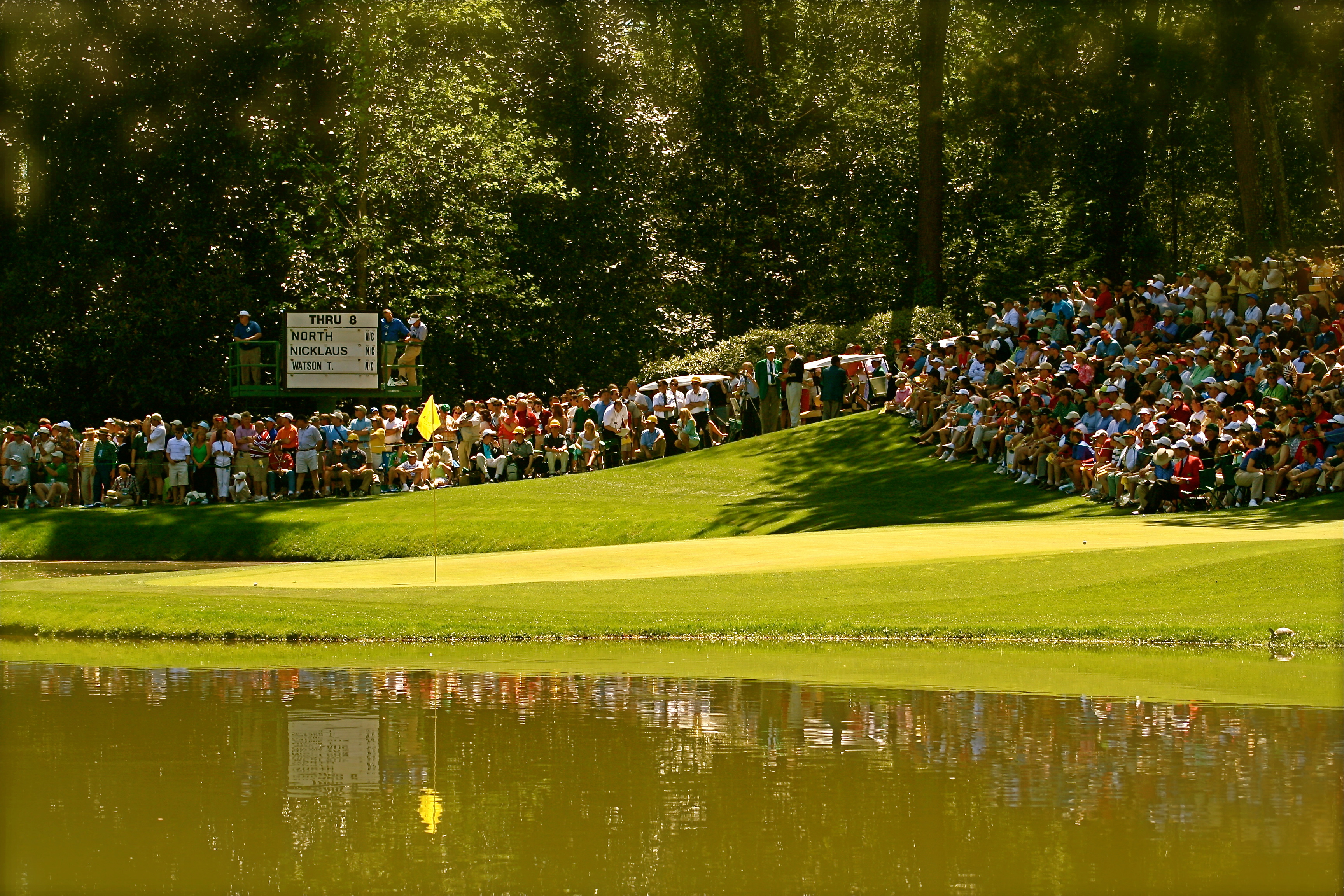 The 9th hole on the par-3 course at the Augusta National Golf Club during the par-3 contest prior to the 2006 Masters Tournament.  Jack Nicklaus' ball is to the left of the pin, and he had his grandson putt it (and he made it).  The sequence can be seen on a video posted to youtube, Jack Nicklaus - Augusta 2006.  Andy North's ball is to the right.  Nicklaus, North, and Tom Watson were playing as non-competitors in the par-3 contest.