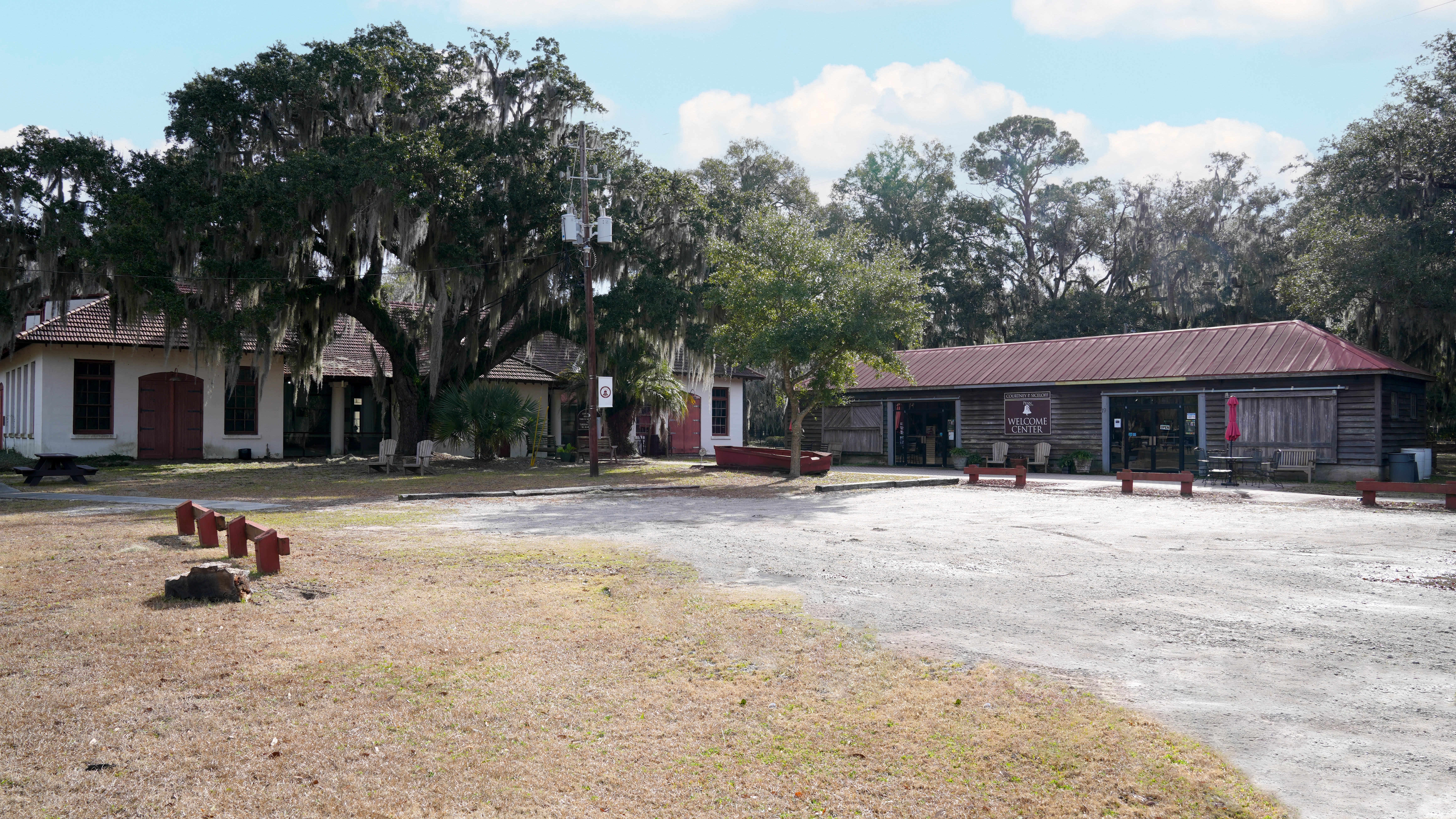 A long wooden building next to a larger stucco building with red trim and a red roof.
Penn Center is located in South Carolina and was added to the Network in 2021. This site was first established in 1862 as one of the first schools for formerly enslaved people at the dawn of the Reconstruction era.