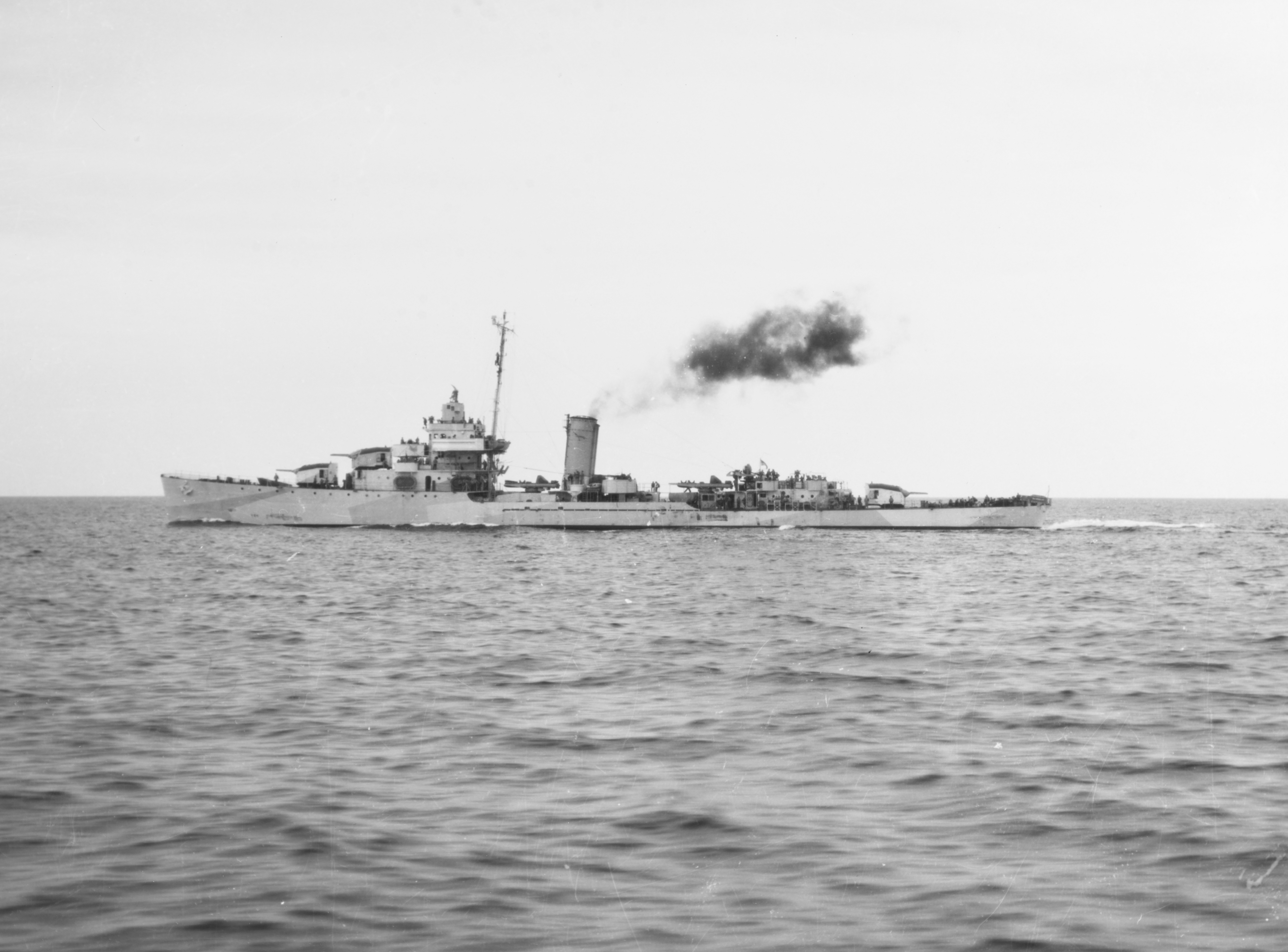 The U.S. Navy destroyer USS Warrington (DD-383) underway in the Las Perlas Archipelago, Panama Canal Zone, 23 April 1943. Note that she is painted in the seldom used Camouflage Measure 16.