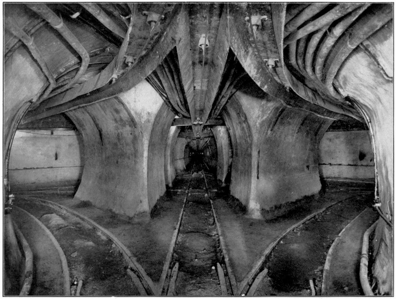 Original caption:  Rapid Transit: "TYPICAL STREET INTERSECTION -- CHICAGO."  Centennial History:  "SECTIONAL VIEW OF THE ILLINOIS TUNNEL COMPANY'S TUNNELS."  This is the version from the Centennial History, as it was printed with higher resolution and without retouching.