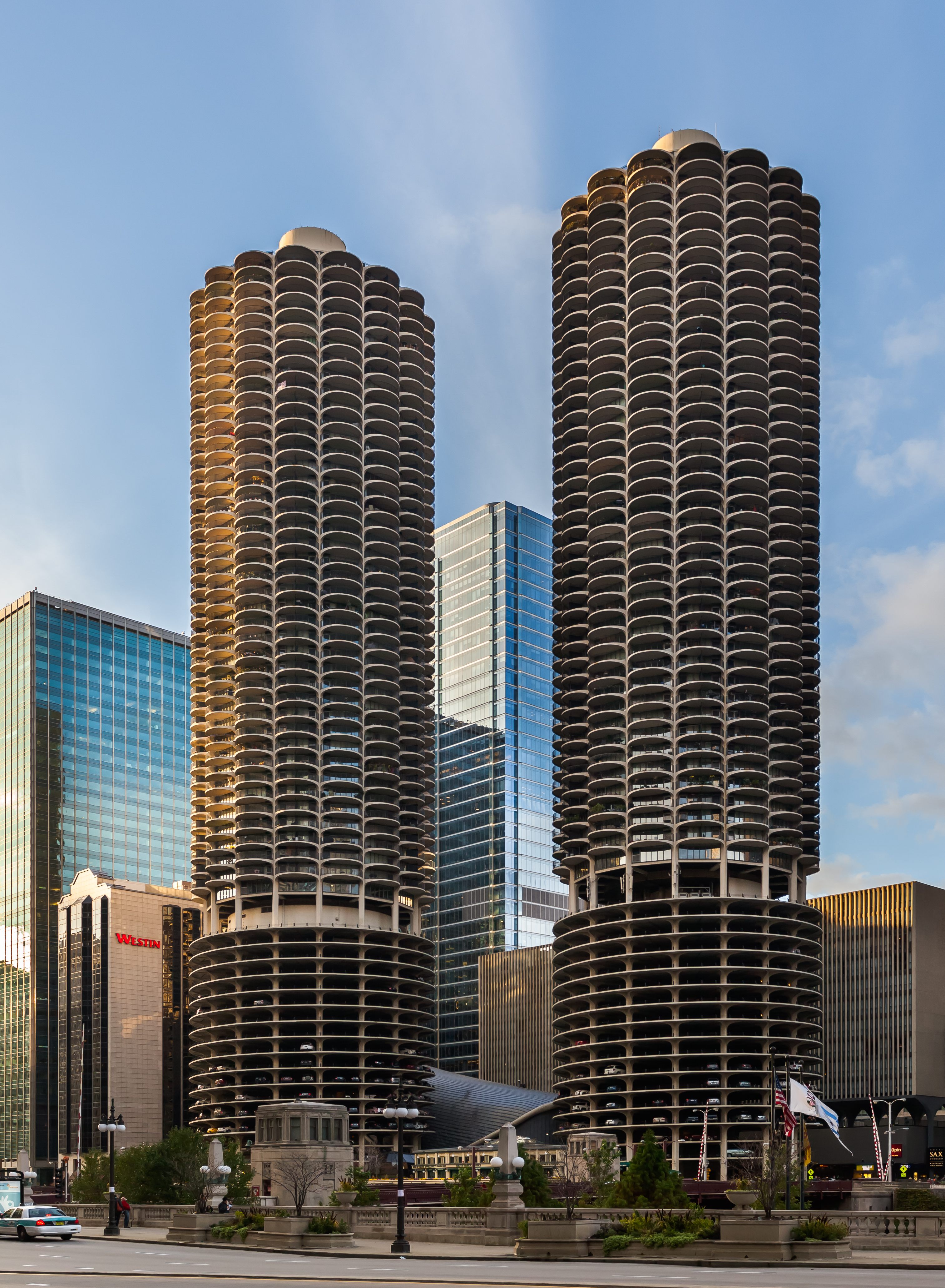 Marina City is a mixed-use residential/commercial building complex located in the center of Chicago, Illinois. It sits on the north bank of the Chicago River directly across from the Loop district. The complex, that was designed in 1959 by Bertrand Goldberg and completed in 1964, consists of two corncob-shaped 179 m, 65-story towers.
