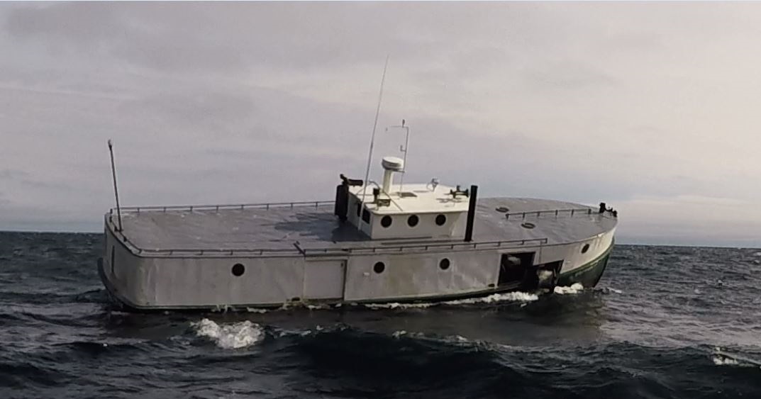 Great Lakes fish tug, Oliver H Smith, lifting nets in a northeast gale near Death's Door (Port de Morts), Lake Michigan.
Port De Morts, also known as Death's Door, is the Cape Horn of the Great Lakes. It is legendary for the countless ships that are scattered across its bottom, the victims of its violent storms and relentless current.
The area lies at the tip of the Door Peninsula of Wisconsin and like Cape Horn it divides two bodies of water. On its west side is the waters of Green Bay and to its east, Lake Michigan. The forces of both bodies collide in this narrow passage and have resulted in the deaths of many hundreds of mariners over the years.
These merciless waters are avoided, even to this day, by the freighter captains on the shipping lanes.