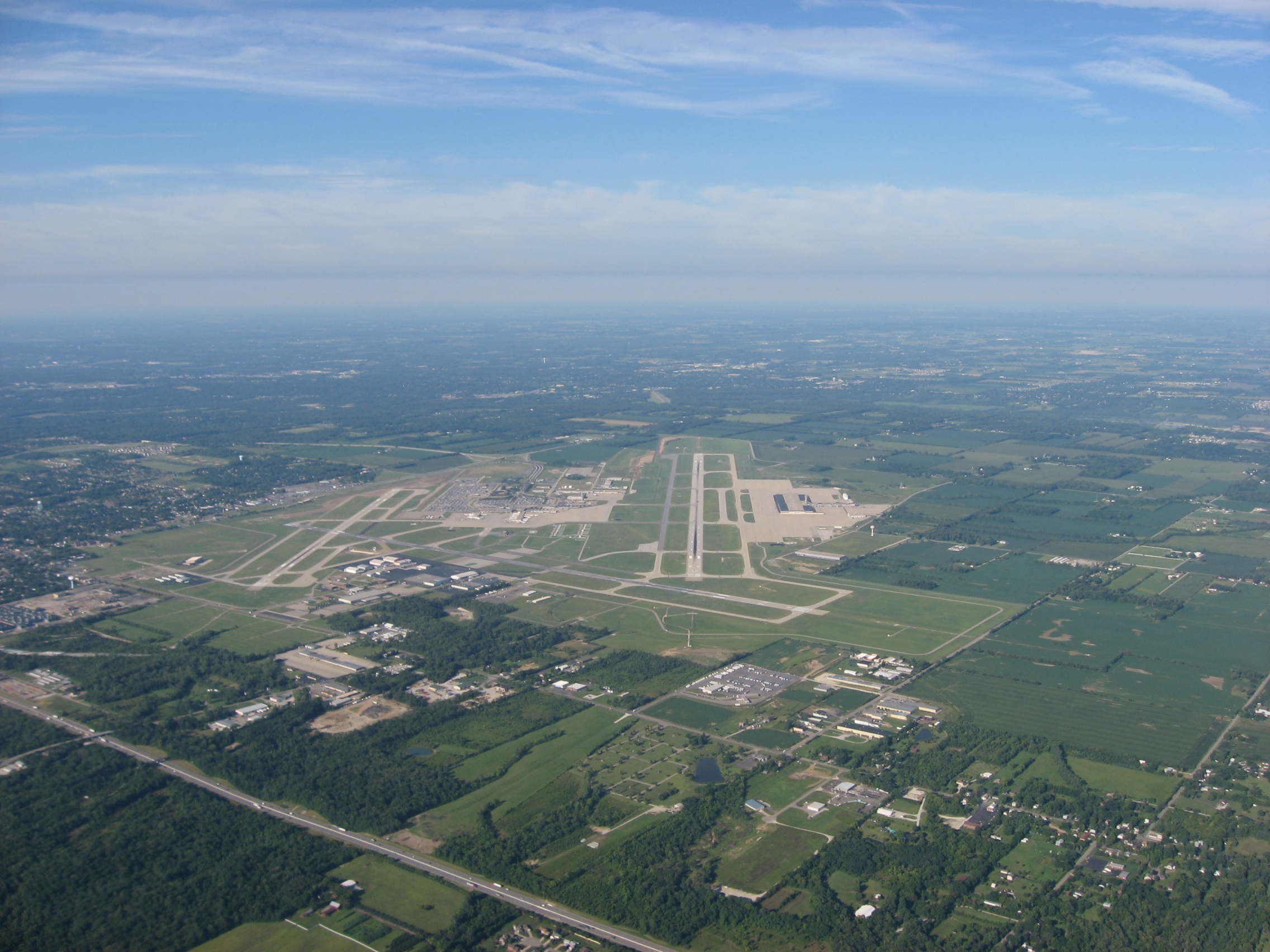 Aerial view down Runway 24R of the James M. Cox Dayton International Airport in Vandalia, a northern suburb of the city of Dayton, Ohio, United States.  Picture taken from a Diamond Eclipse light airplane at an altitude of 4,480 feet MSL and a bearing of approximately 235º.